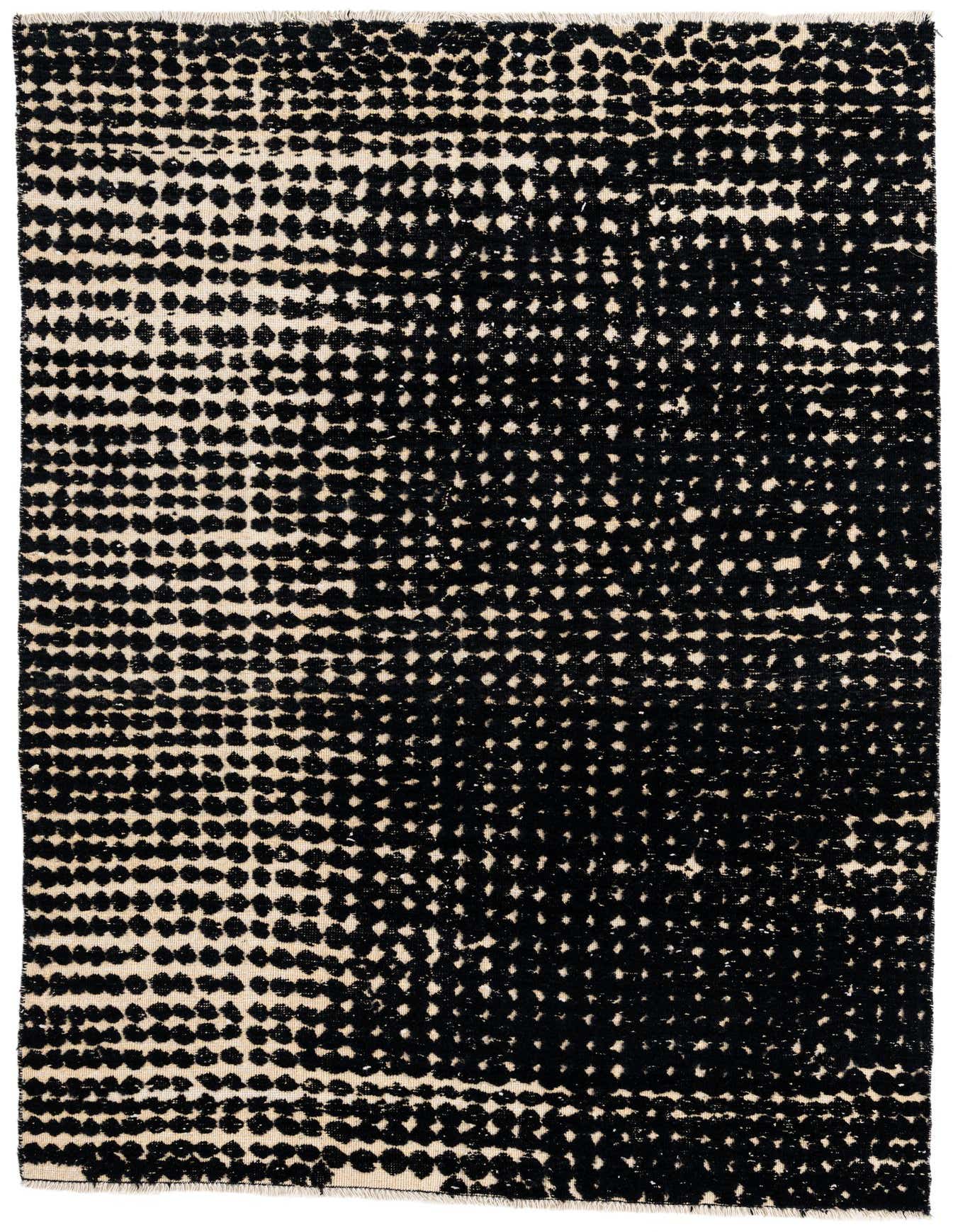 A 5x8 rectangular black and beige wool shag rug with a modern abstract dot pattern, perfect for a living room.