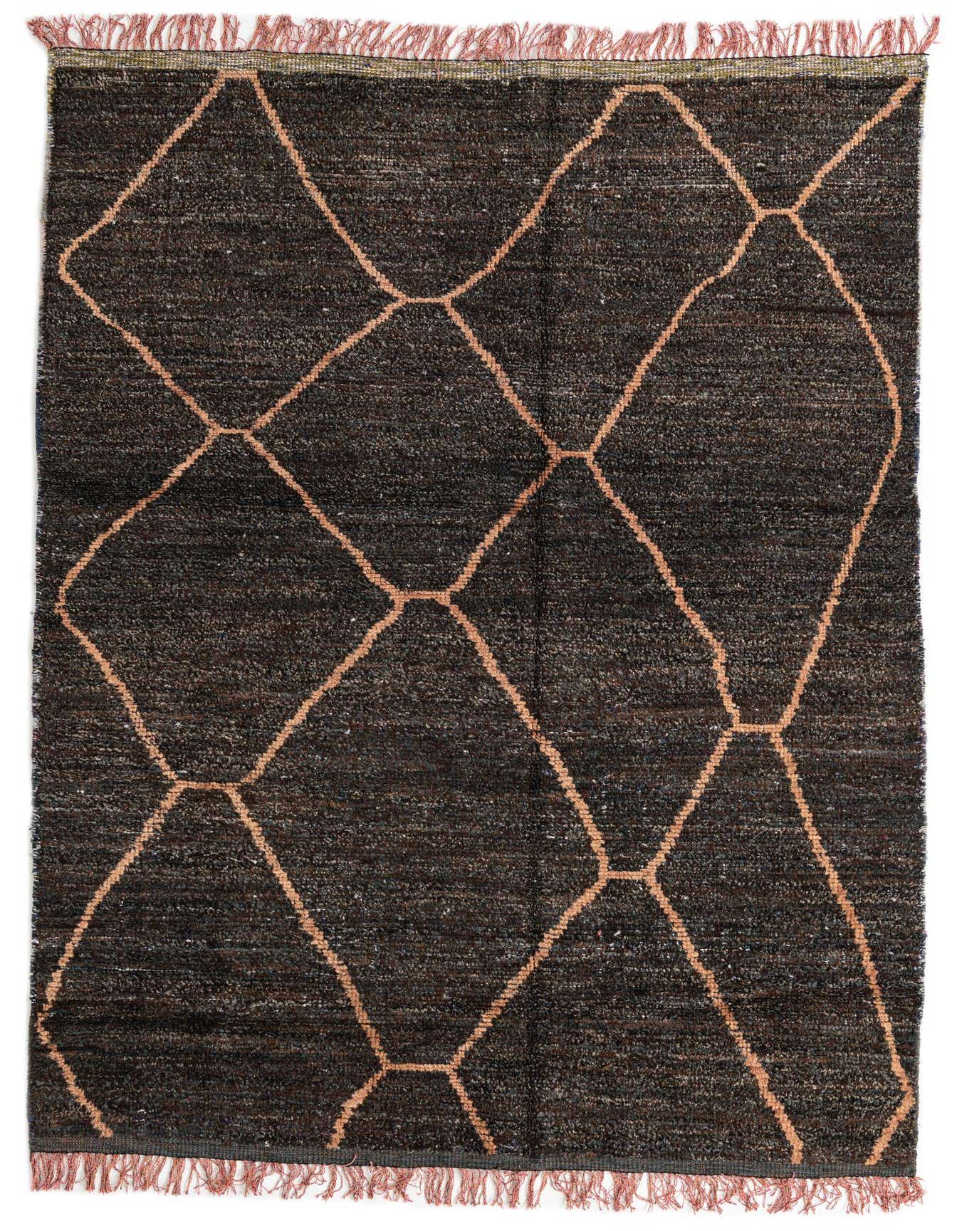A 6x9 rectangular black shag rug with a modern tribal diamond pattern in light brown, featuring fringed edges.
