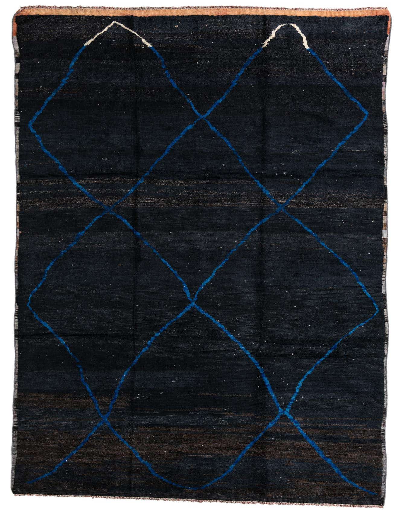 A rectangular 8x12 black wool shag rug with a modern tribal diamond pattern in blue and white, suitable for an indoor living space.