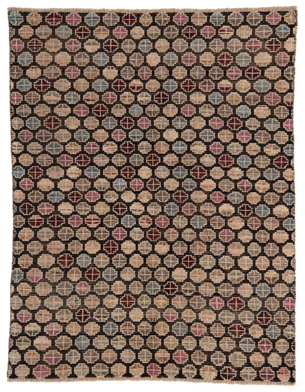 A 5x8 rectangular black wool shag rug with a modern tribal pattern of interlocking beige, blue, and maroon circles.