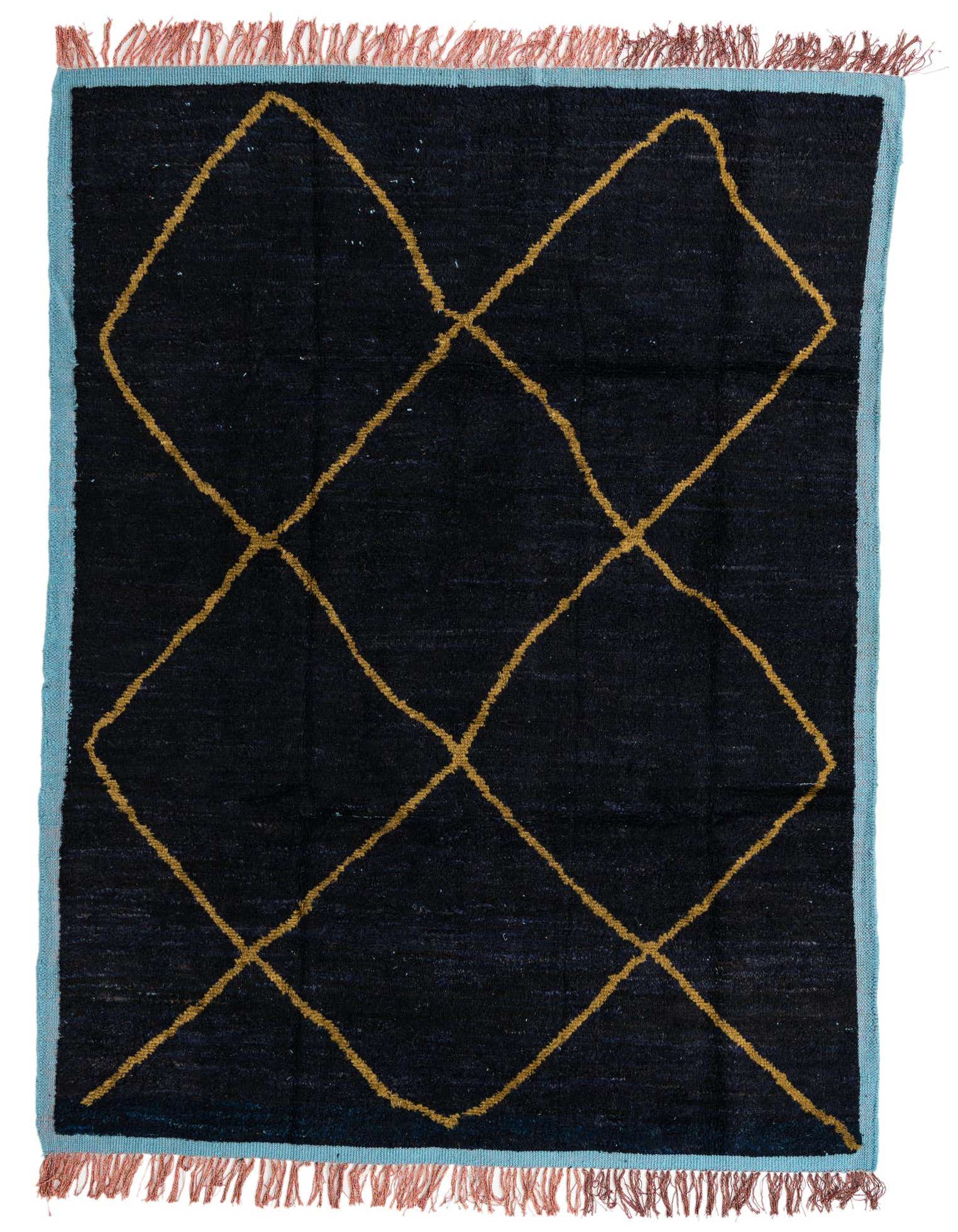 A 7x10 rectangular black shag rug with an irregular gold diamond pattern, light blue border, and terracotta fringe.