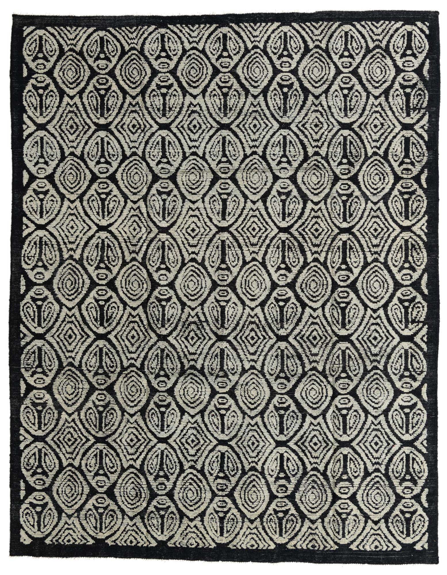 A rectangular 8x10 black wool shag rug with an intricate tribal, modern, and abstract pattern.
