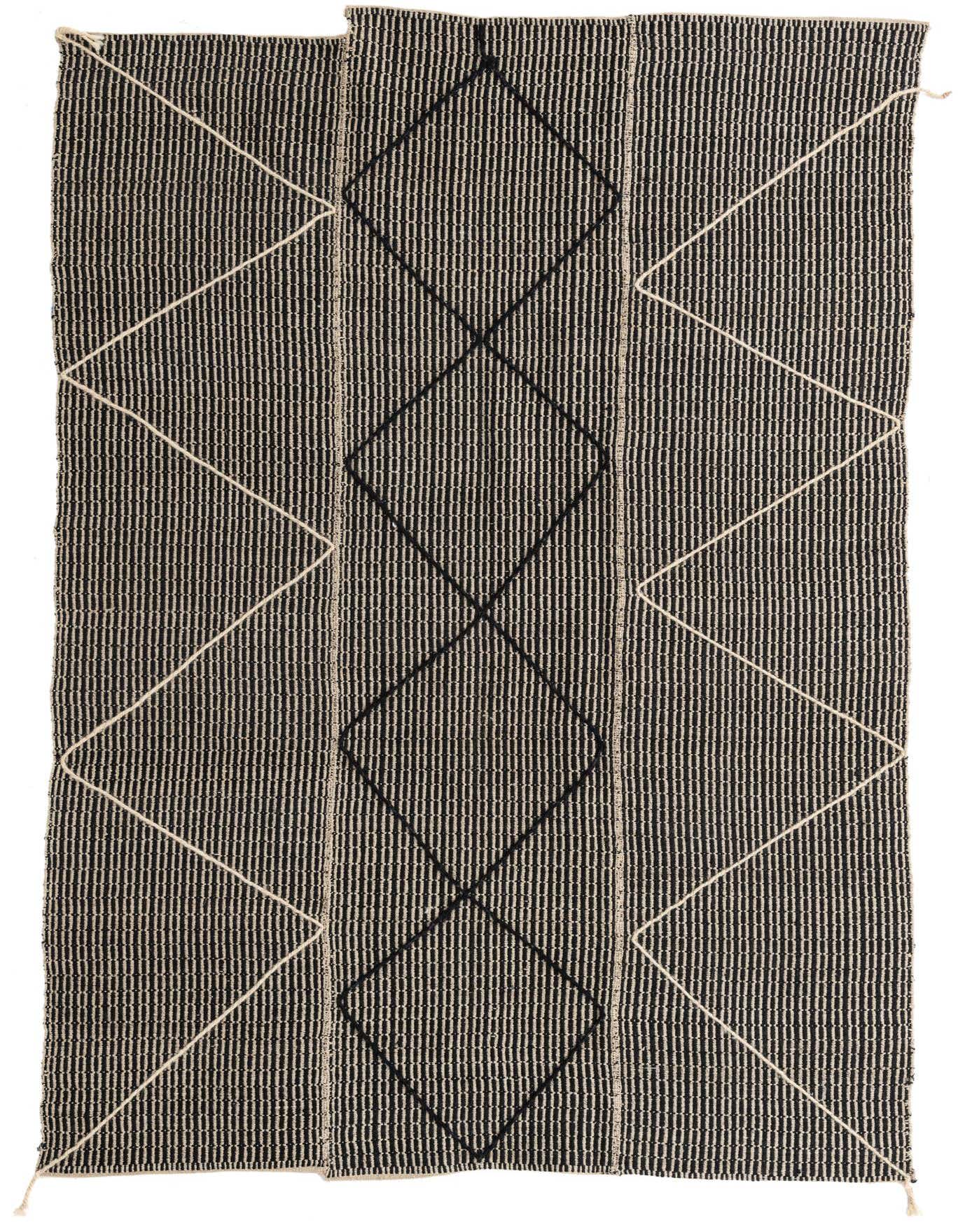 A 5x8 rectangular black shag rug with a modern tribal pattern of white and black diamonds.