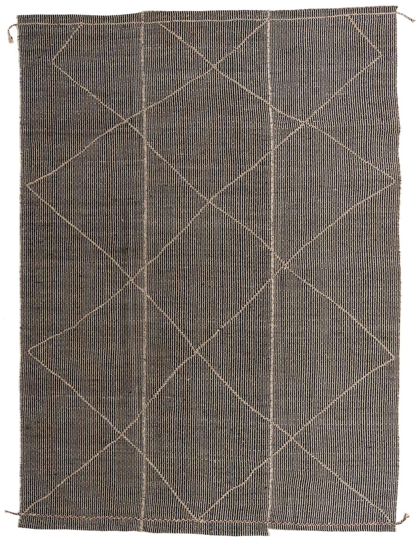 A 10x14 rectangular black shag rug with a subtle cream tribal diamond pattern, ideal for a living room.