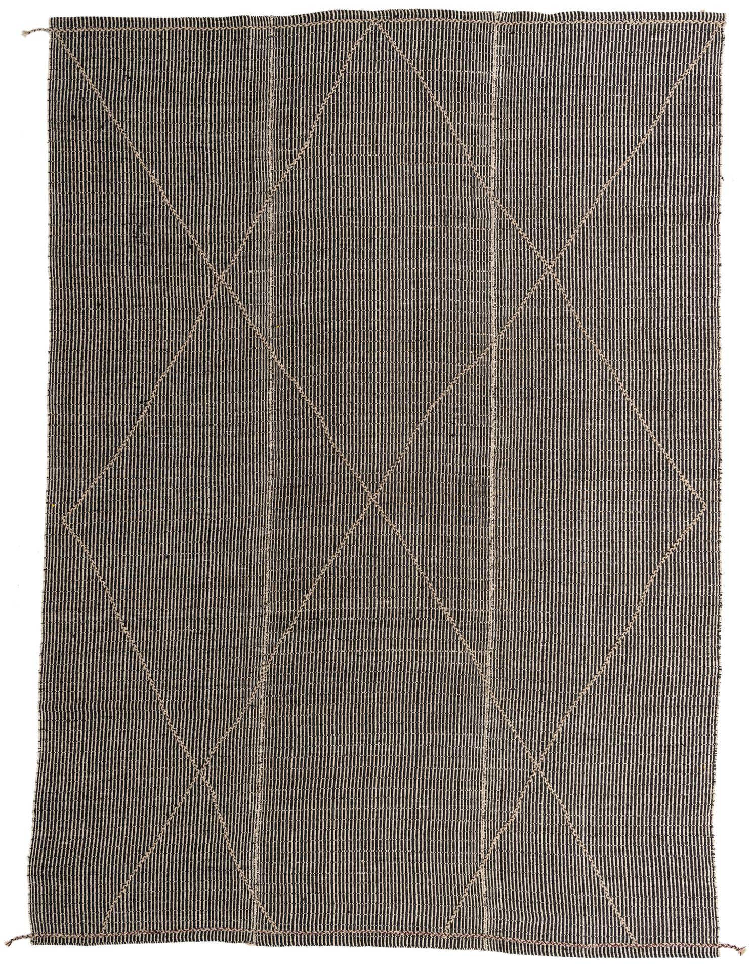 A 10x14 black rectangular wool shag rug with a subtle tribal geometric pattern in lighter tones, handmade for indoor use.