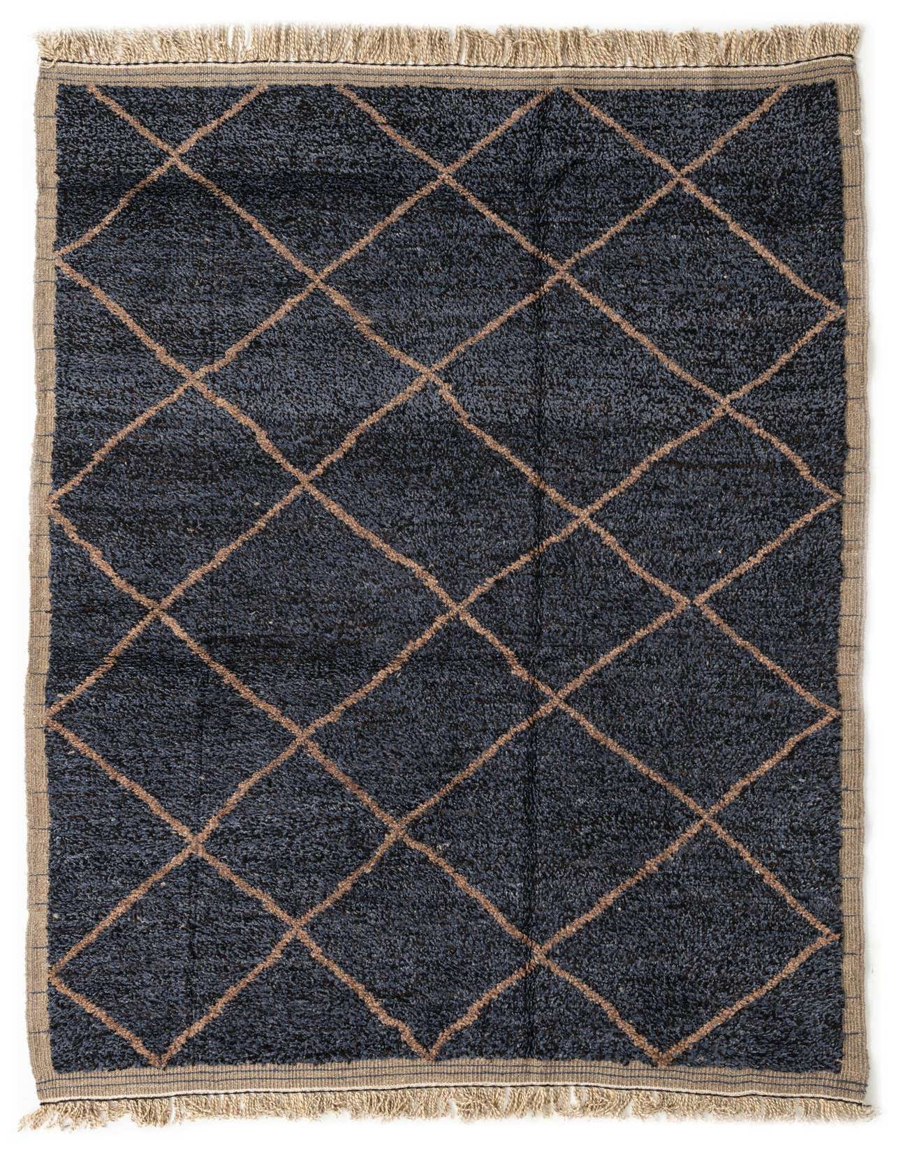 A rectangular 6x9 black shag rug with a brown diamond tribal pattern and fringed edges, suitable for a living room.