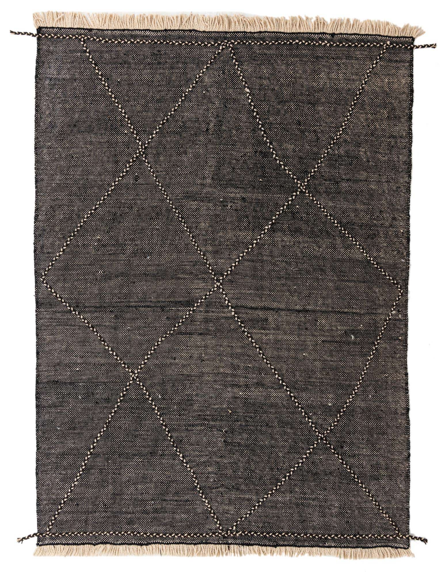 A 7x10 rectangular black wool shag rug with a modern tribal diamond pattern and fringed edges.