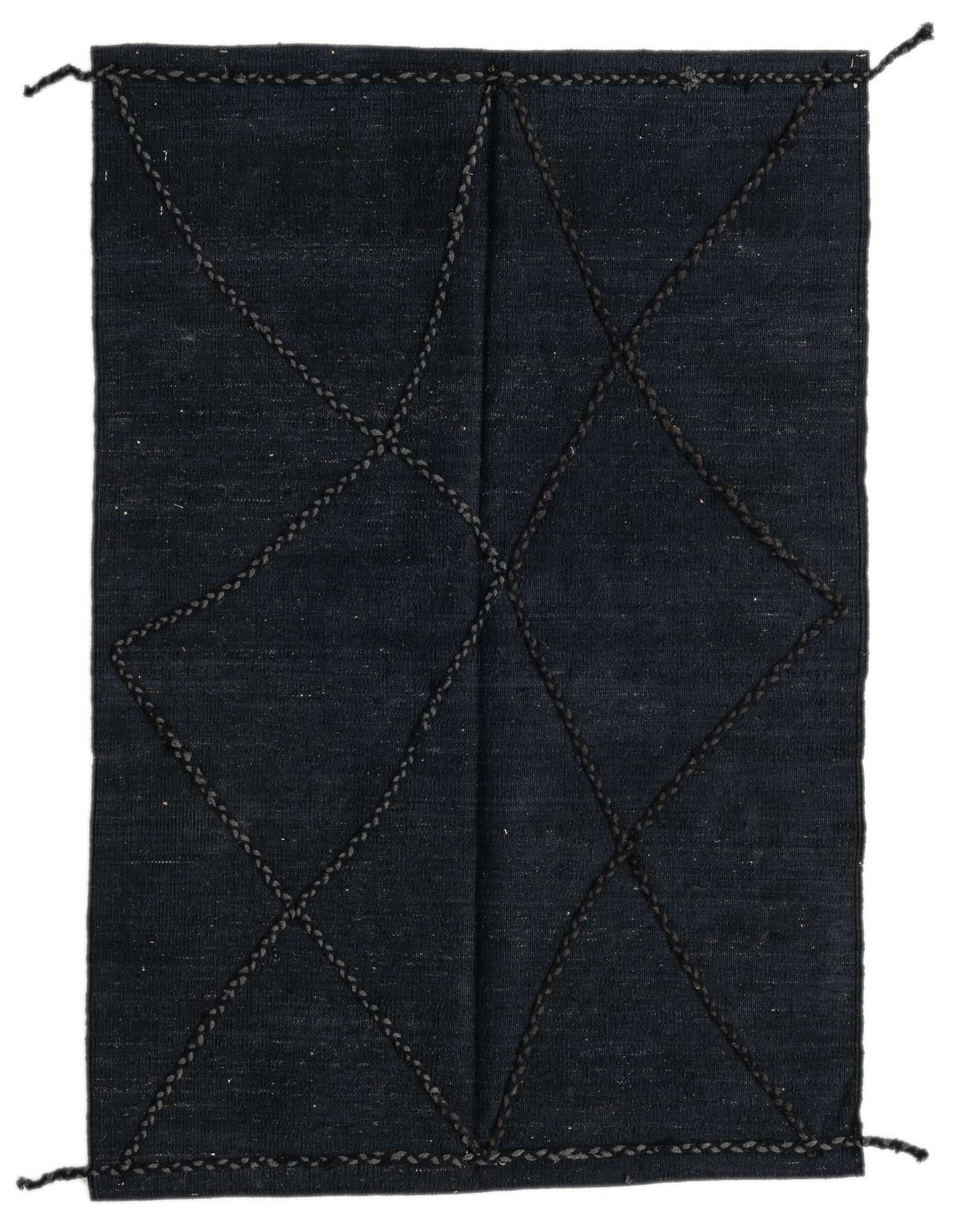 A 3x5 rectangular black wool shag rug featuring a tribal-modern geometric pattern of dark braided lines.