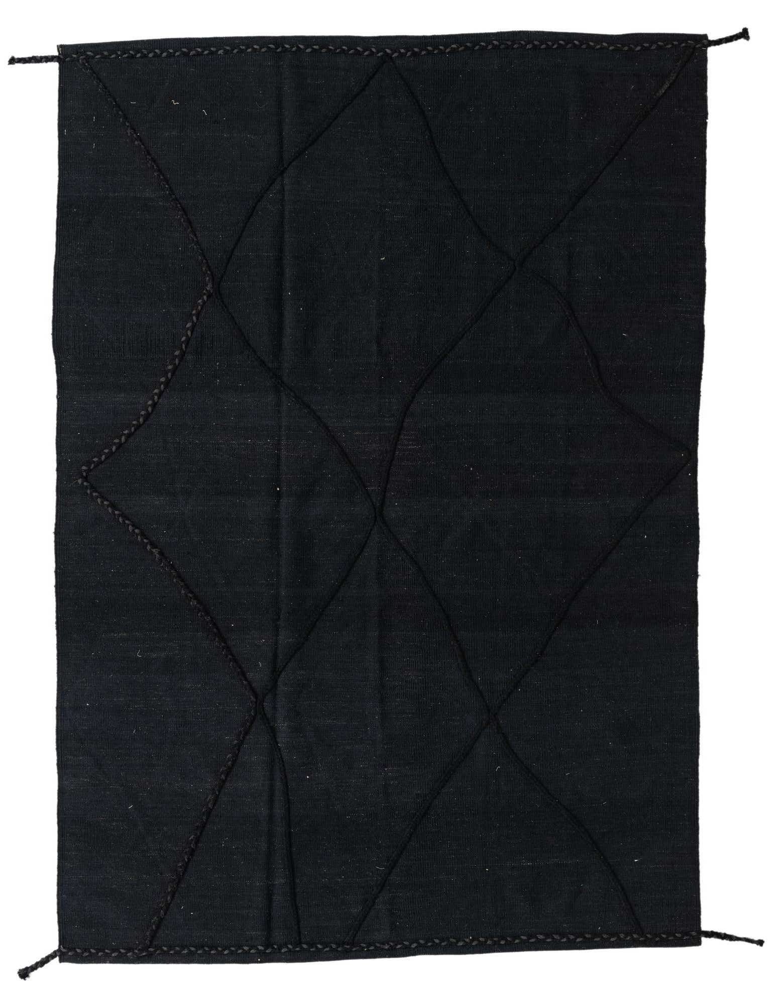 A 5x8 rectangular black wool shag rug with a subtle tribal diamond pattern, perfect for a modern living room.