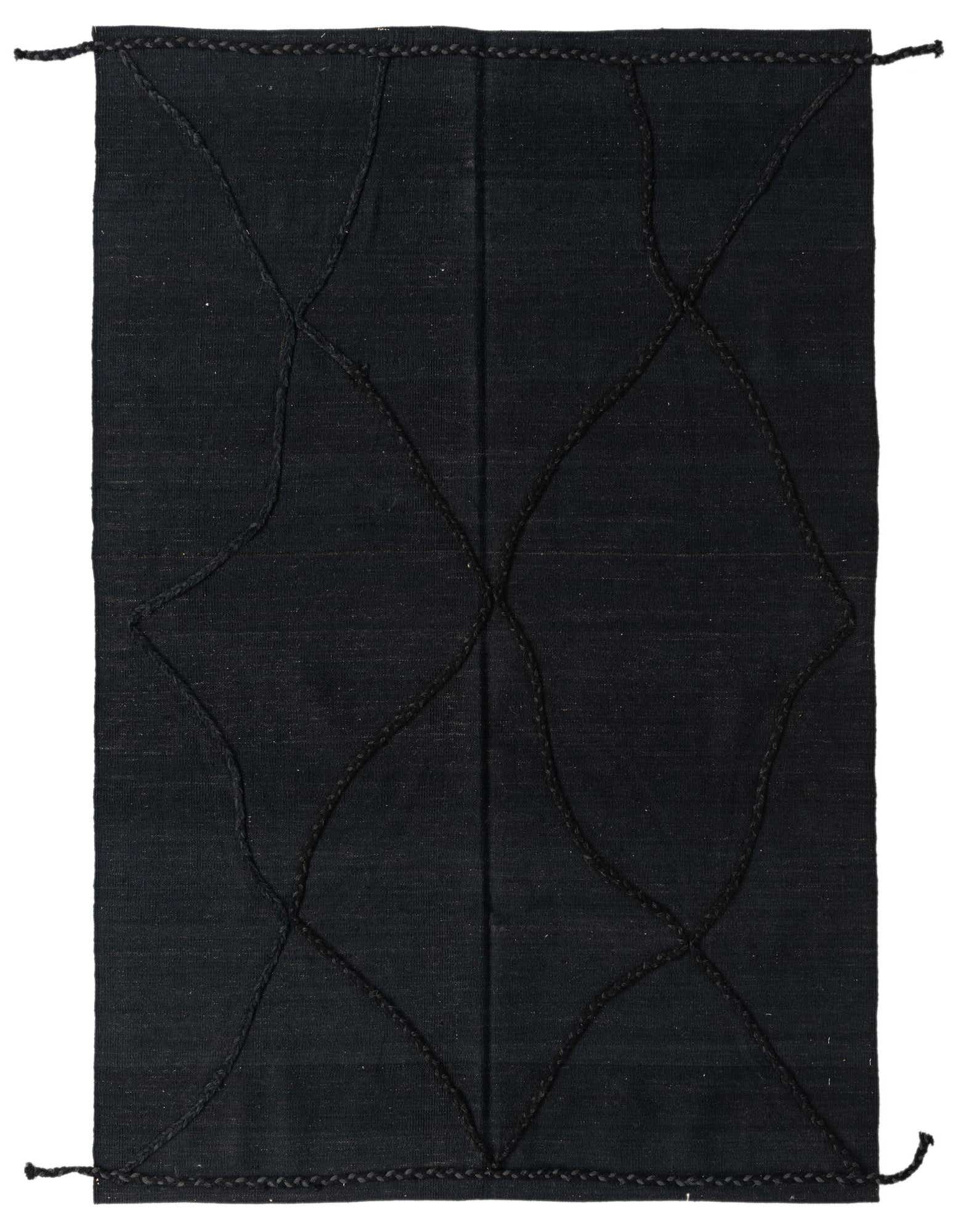 A 4x6 rectangular black wool shag rug with an abstract tribal pattern, perfect for a modern living room.