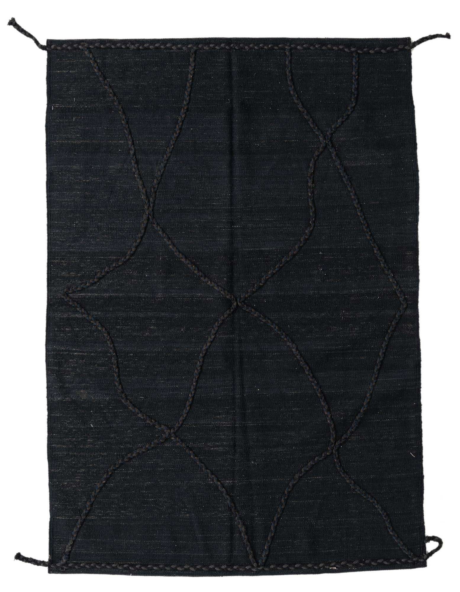 A 4x6 rectangular black shag rug with a modern tribal pattern of braided wool lines forming an abstract lattice design.