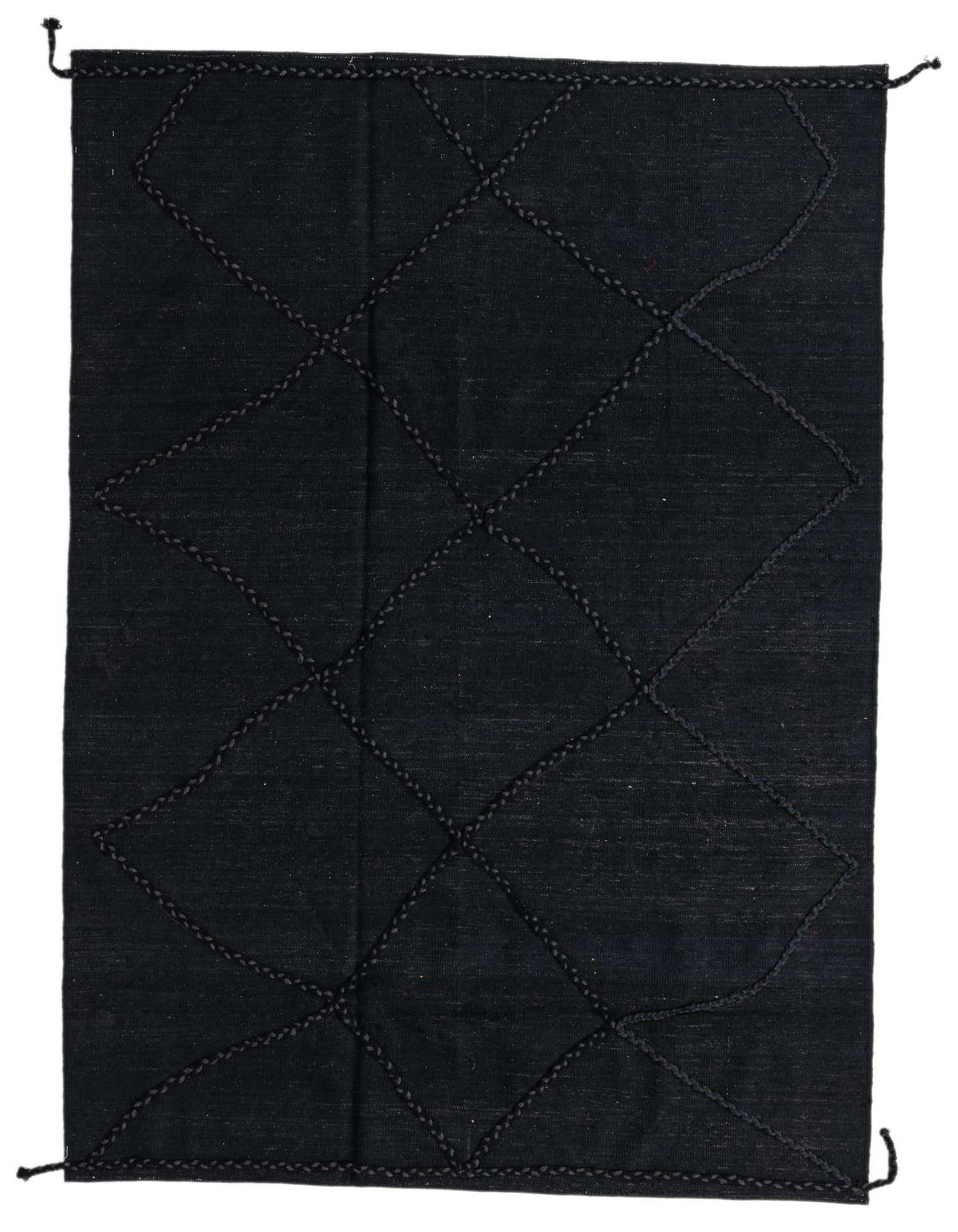 A 5x8 rectangular black wool shag rug with a modern tribal diamond pattern, ideal for a living room.