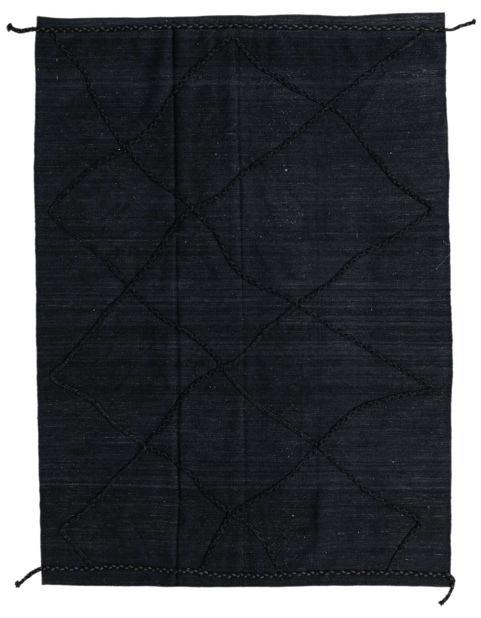 A 5x8 rectangular black wool shag rug with a subtle tribal diamond pattern, ideal for a living room.