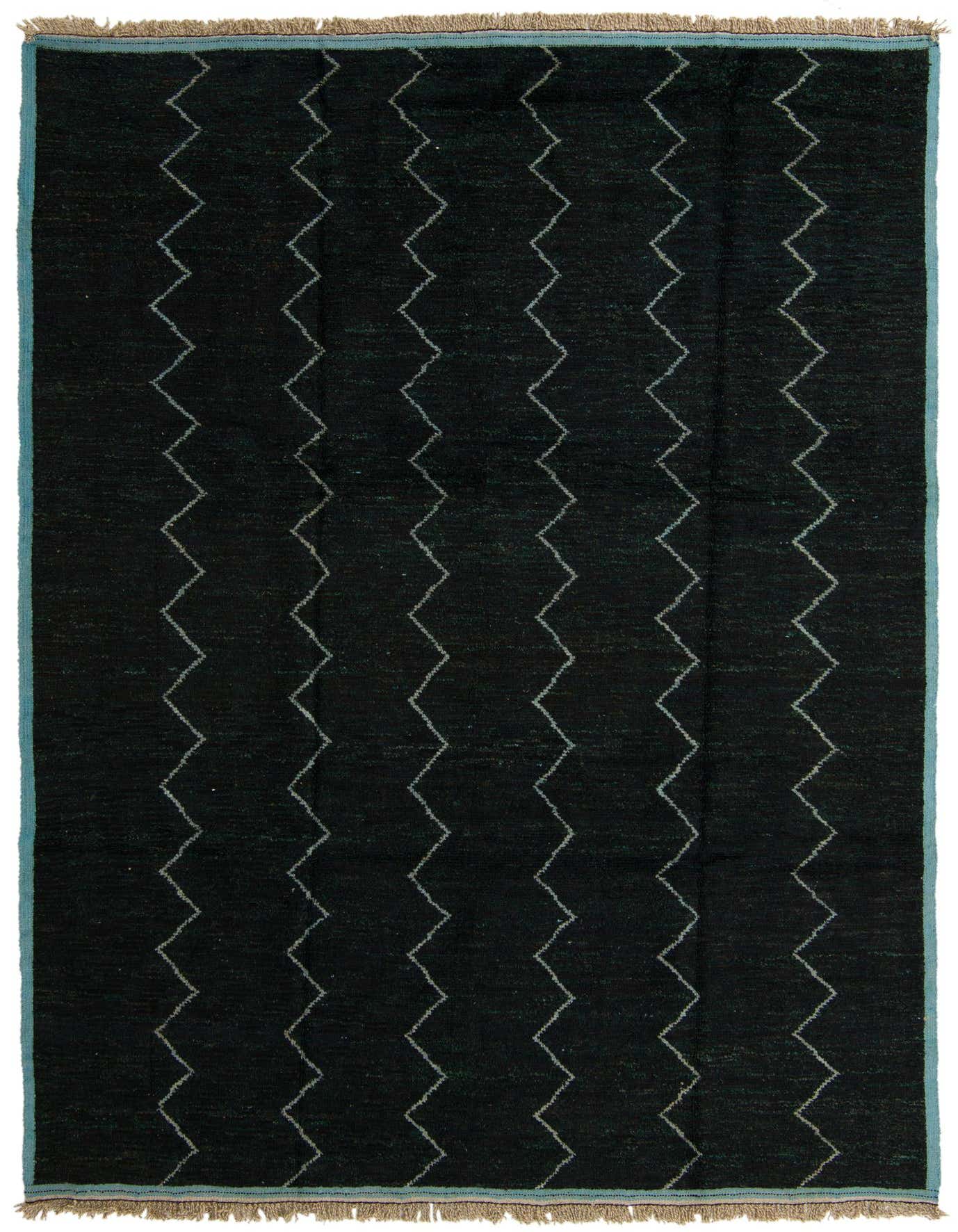 A 9x12 rectangular black Moroccan shag rug with vertical white zigzag lines and light blue border.
