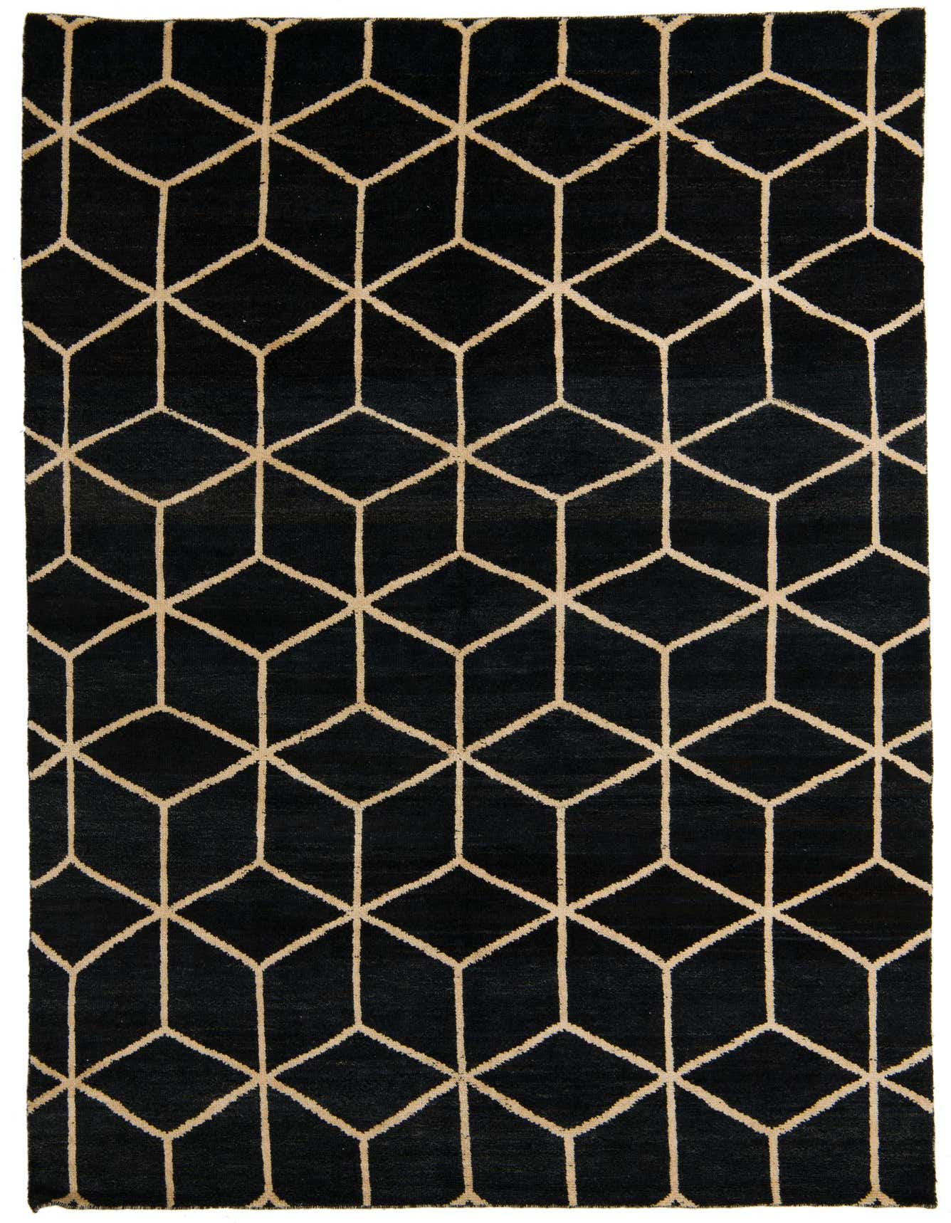 A 6x9 rectangular black wool shag rug with a repeating geometric cube pattern in light beige.