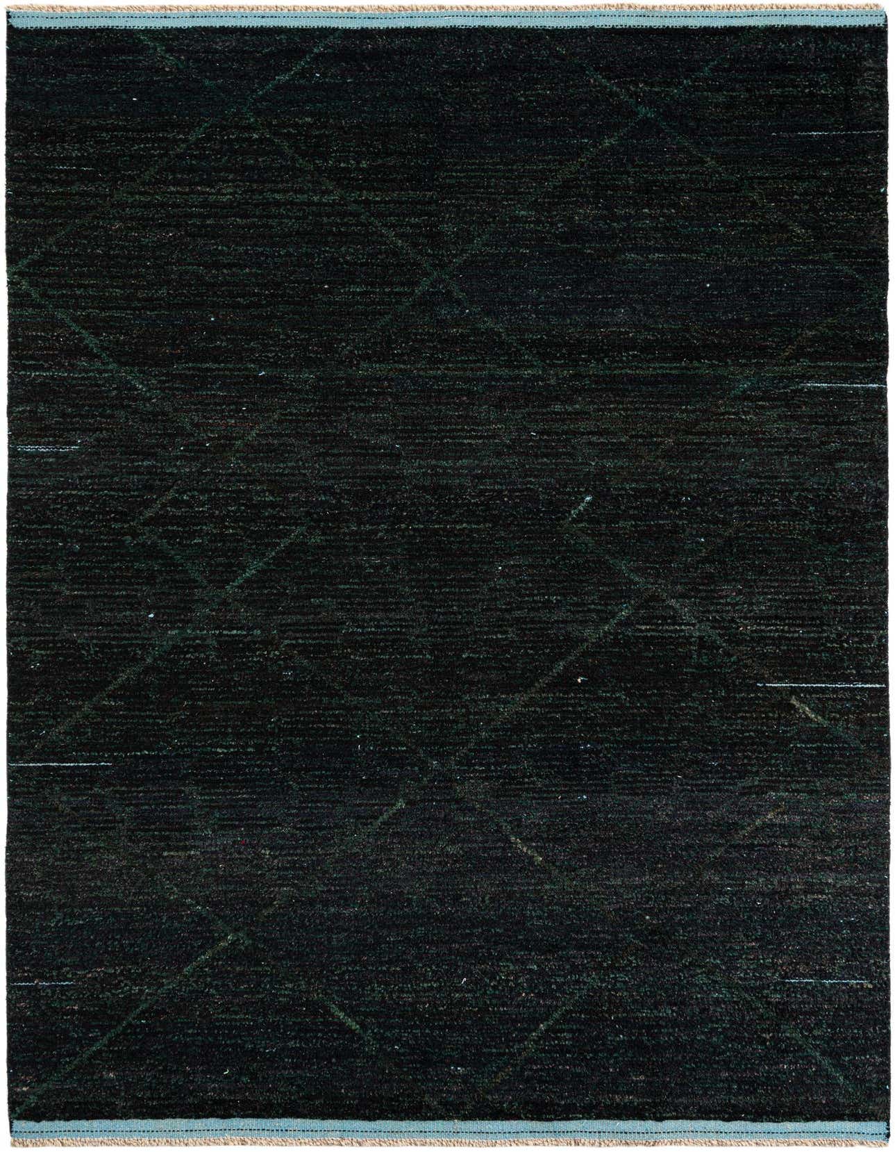 A 6x9 rectangular black shag rug with a subtle tribal diamond pattern, ideal for a modern living room.