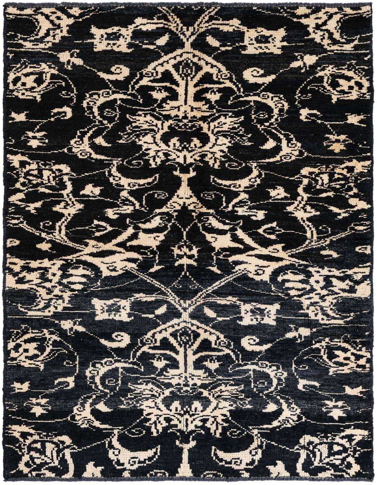 A 4x6 rectangular black shag rug with a cream tribal, oriental, and abstract pattern, suitable for a living room.