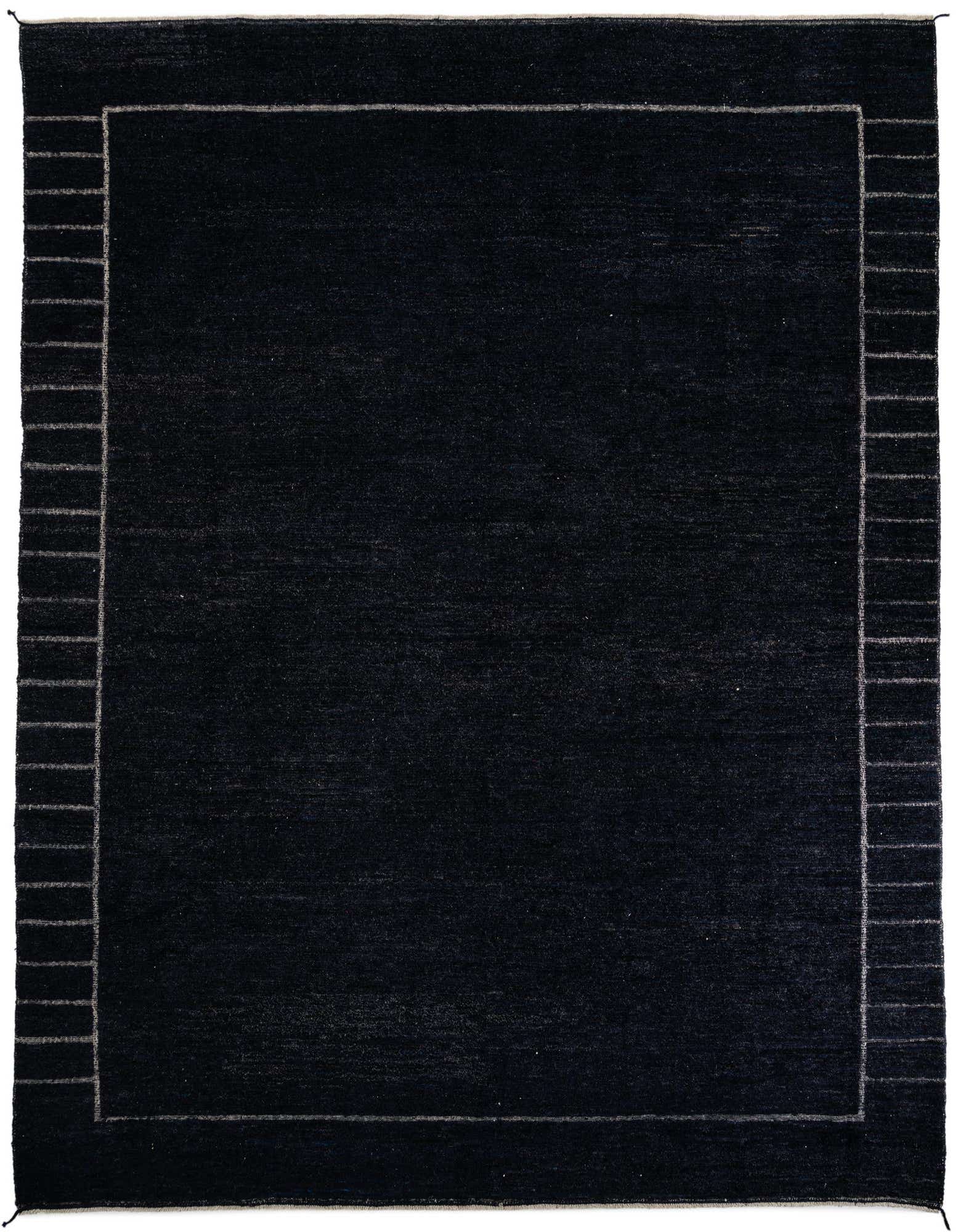 A 12x15 rectangular black shag rug with a subtle gray border featuring a tribal, modern pattern.