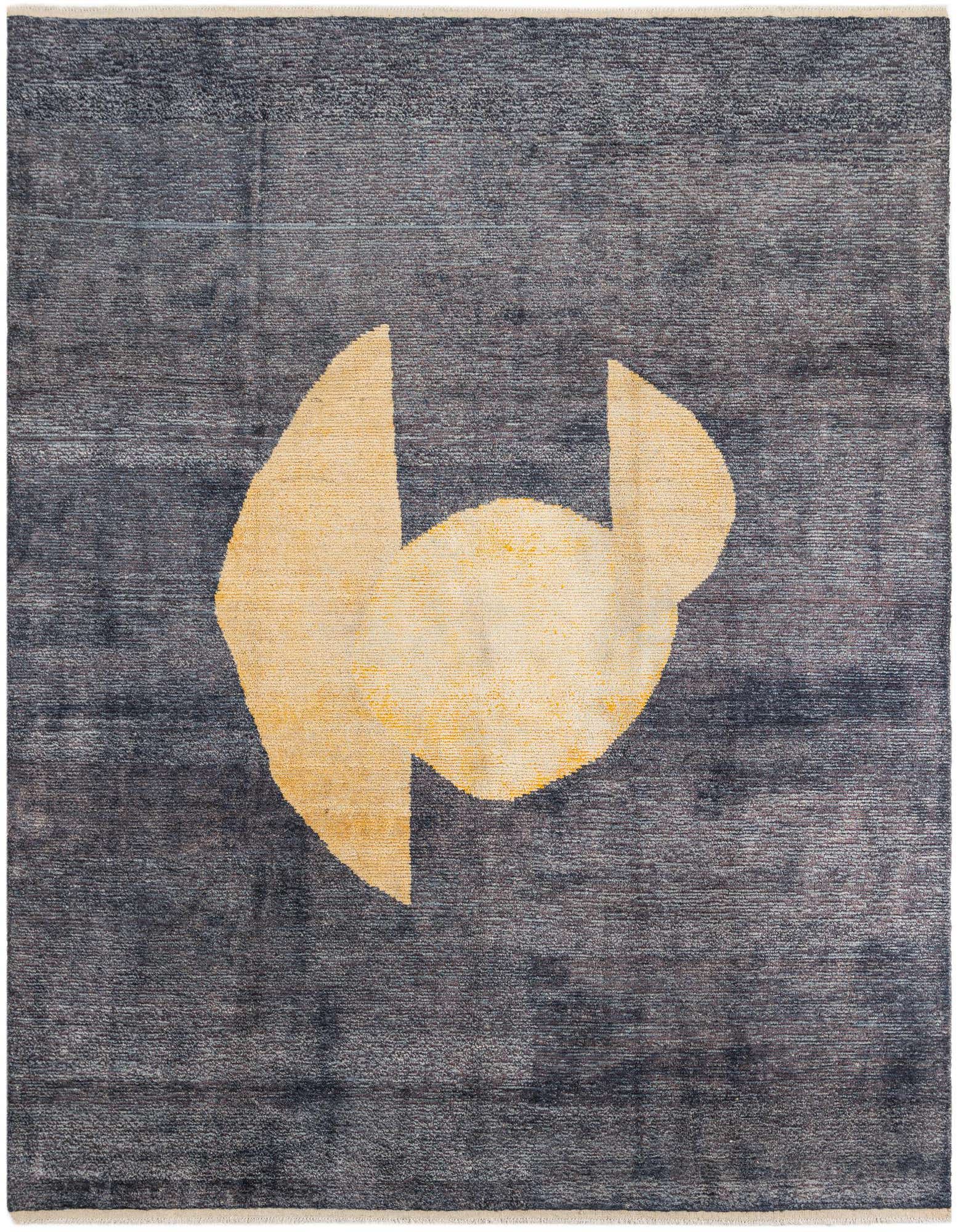 A 9x12 rectangular black wool shag rug with a large, abstract yellow tribal medallion design in the center.