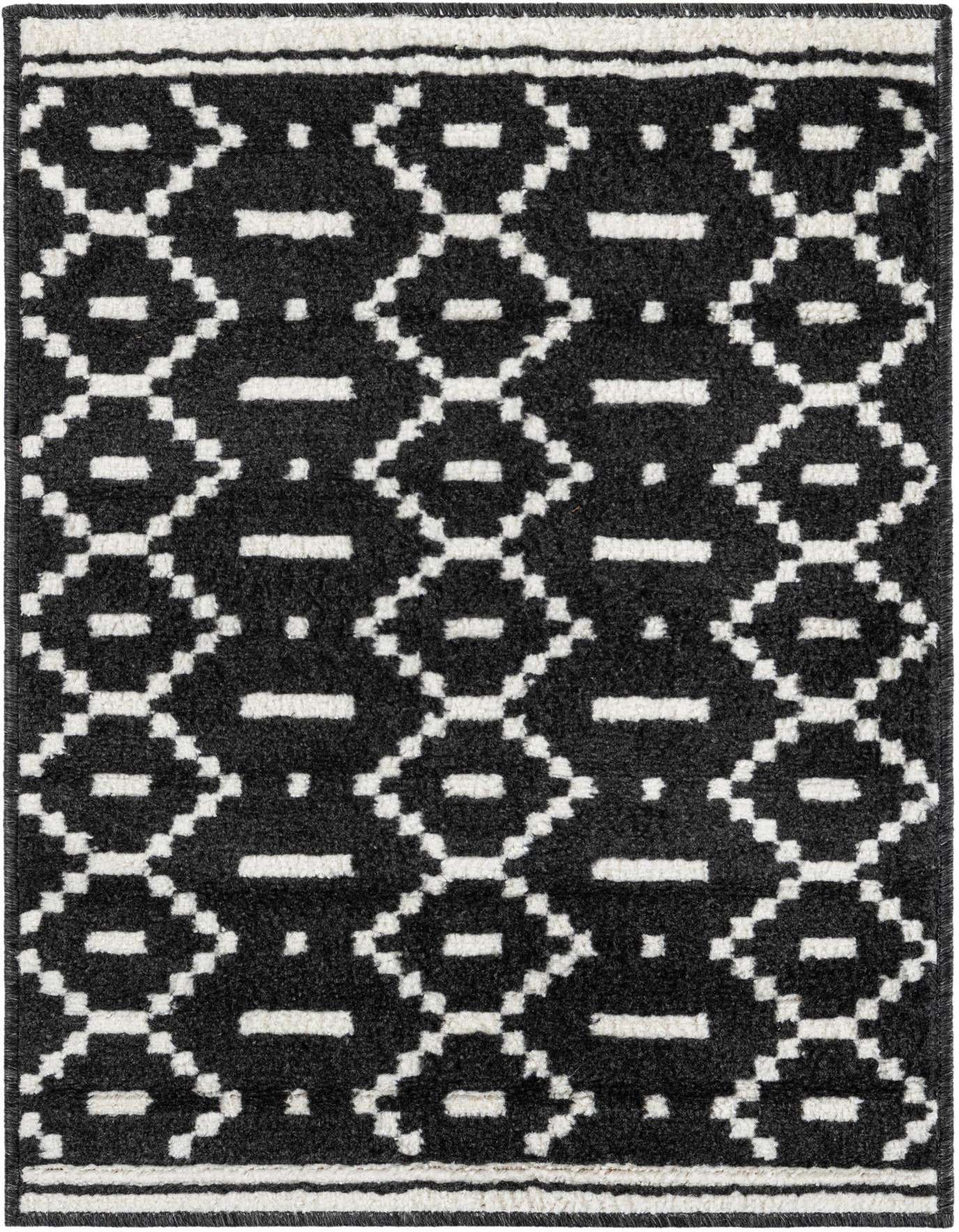 A 2x3 rectangular black and white modern rug with a geometric diamond pattern, suitable for an entryway.