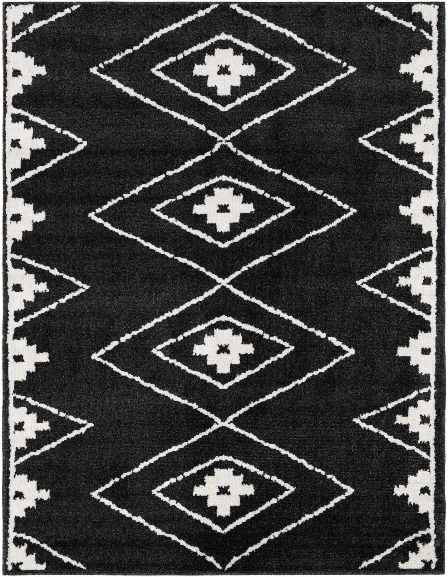 A 5x7 rectangular black area rug with a bold white geometric diamond pattern, suitable for a modern living space.