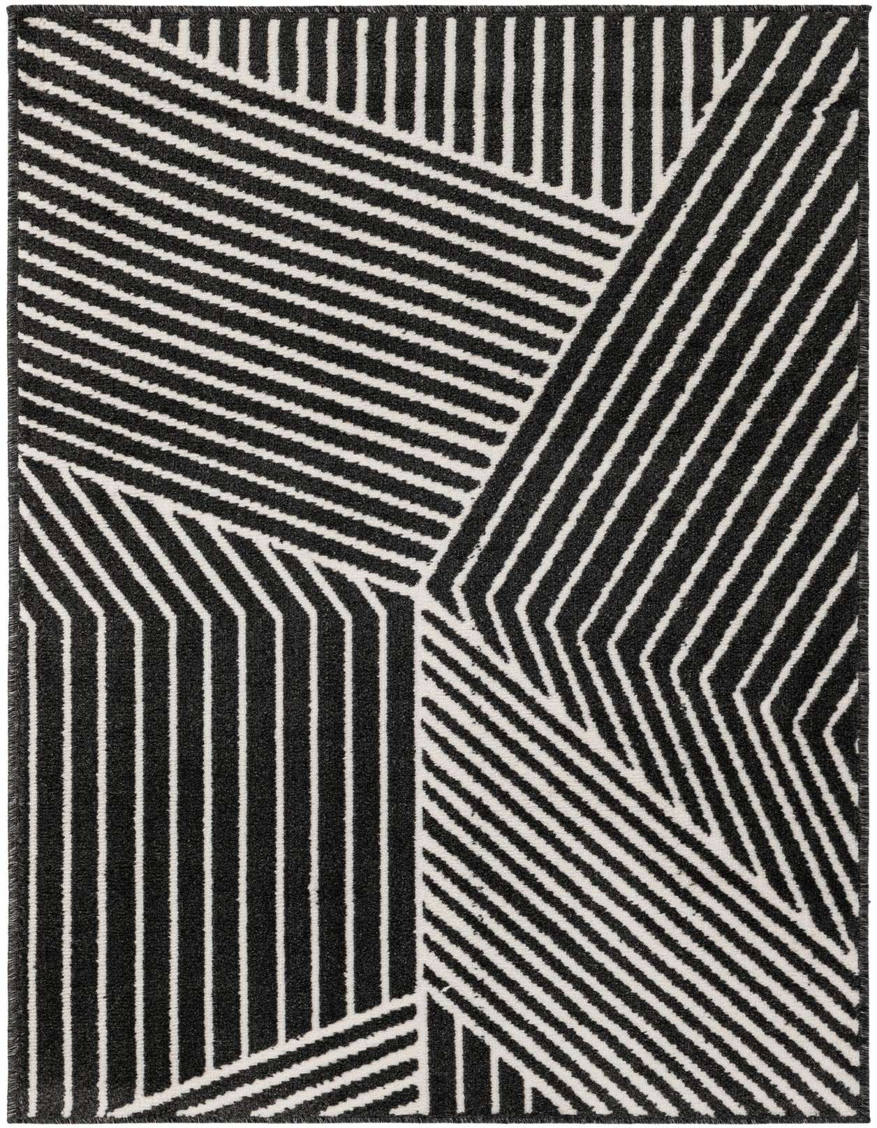 A 3x5 rectangular black and white modern rug with bold geometric stripes in varying directions, suitable for an entryway.