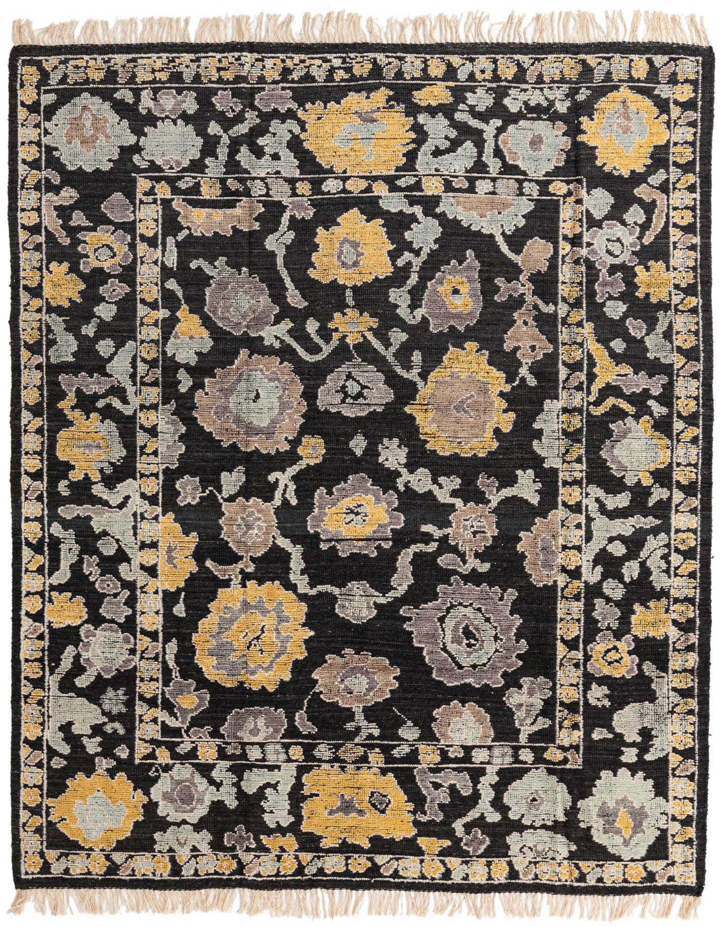 A rectangular 8x11 black wool Oushak rug with a modern abstract floral pattern in yellow, grey, and light blue, featuring a textured pile and fringed edges.