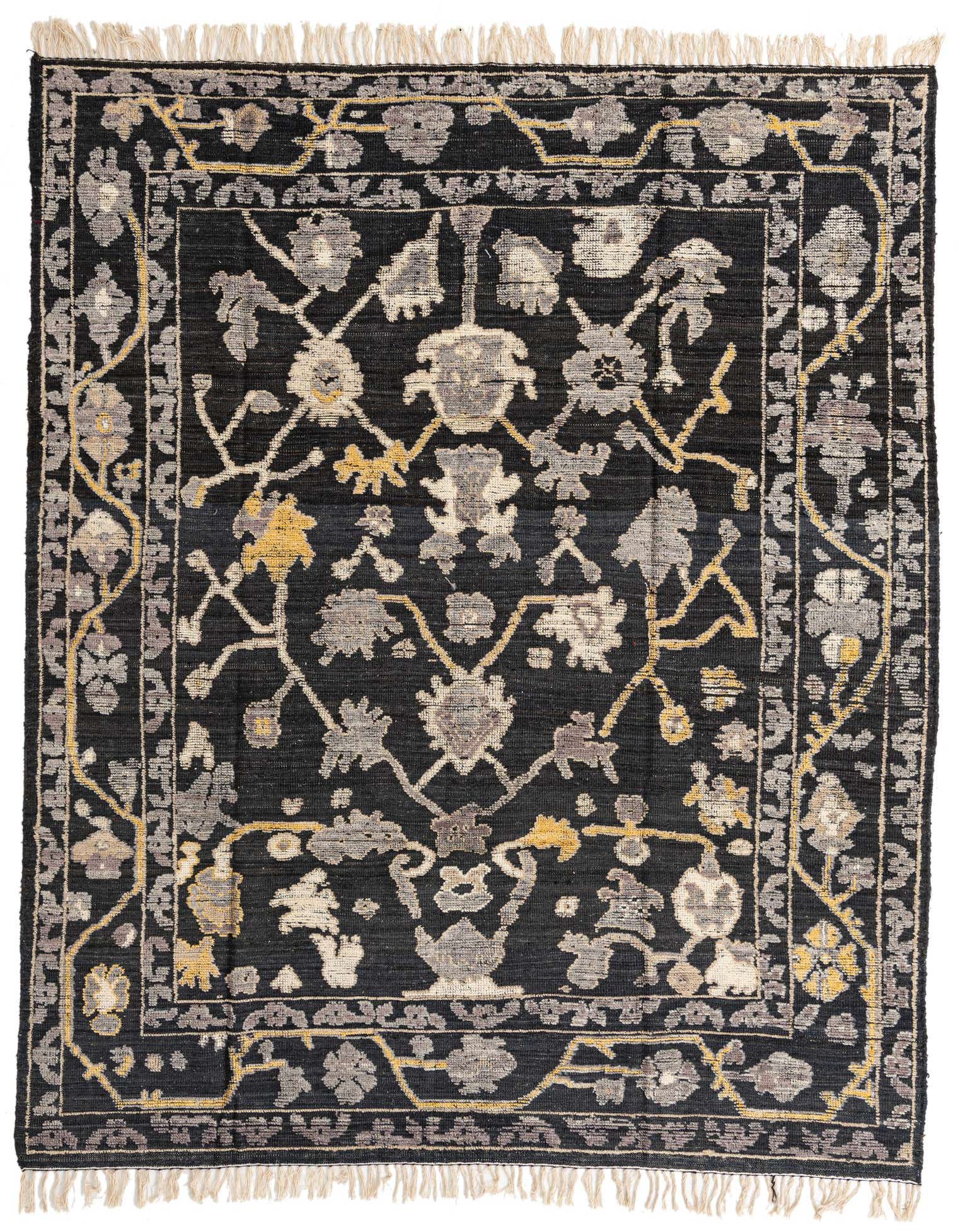 A rectangular 8x10 black wool Oushak rug with an abstract floral pattern in grey, cream, and yellow, featuring short fringe.