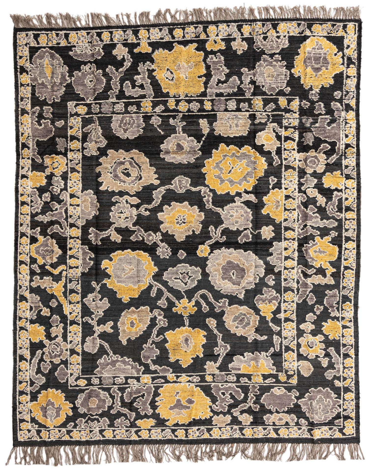 A rectangular 8x10 black wool rug with a modern abstract floral pattern in yellow and gray, featuring short fringes.