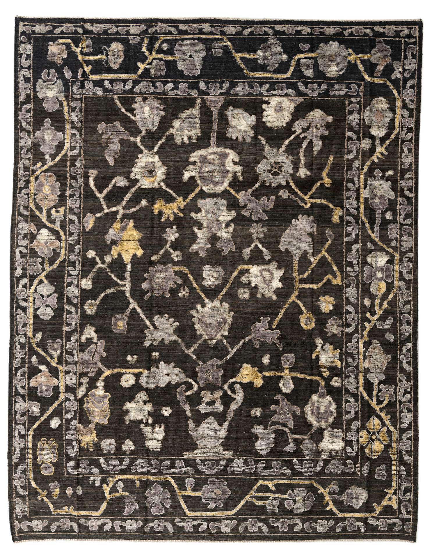 A 9x12 rectangular black Oushak rug with a modern floral pattern in grey, beige, and yellow.