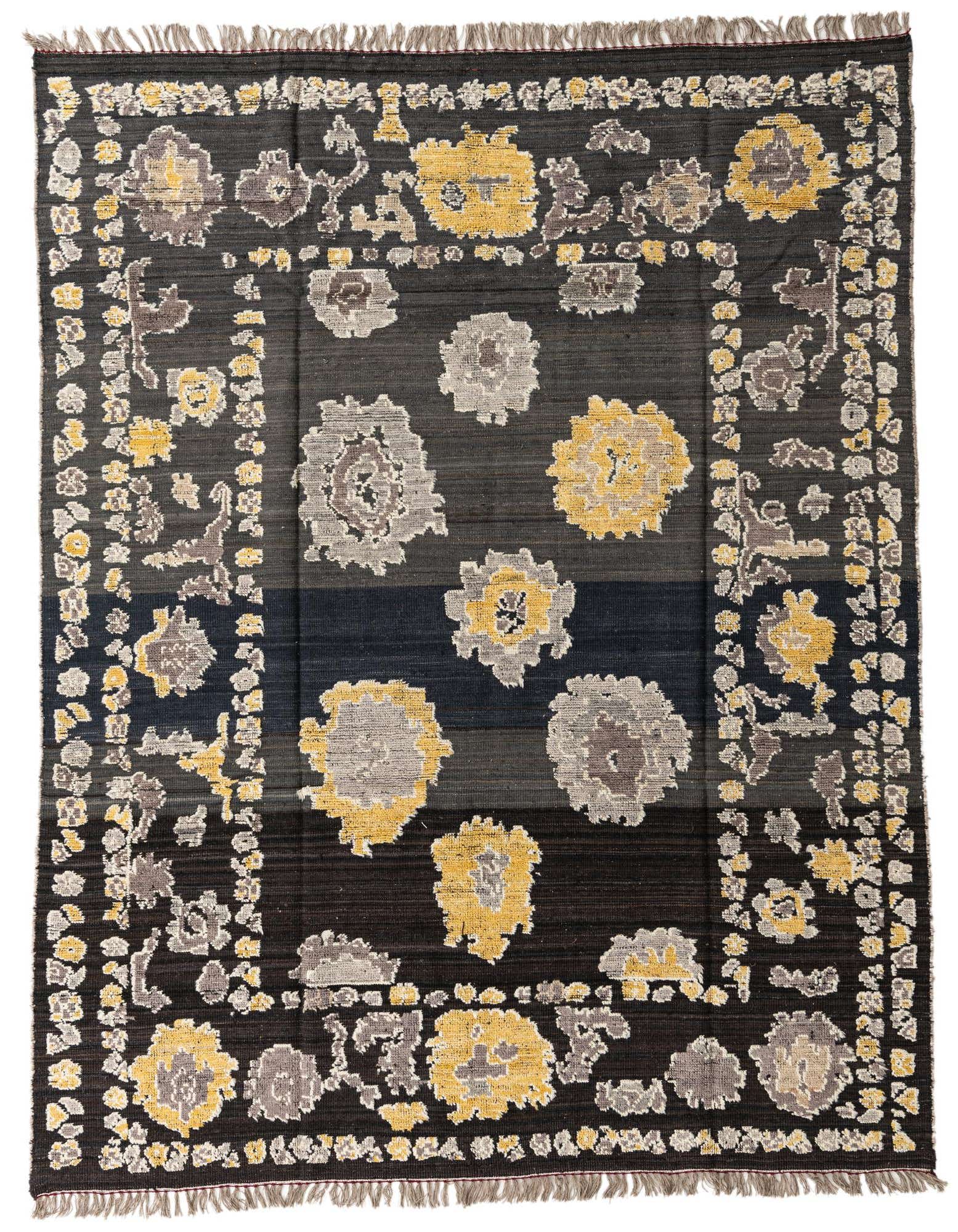 An 8x10 rectangular black wool rug with a modern abstract pattern featuring yellow and gray floral motifs and a decorative border.