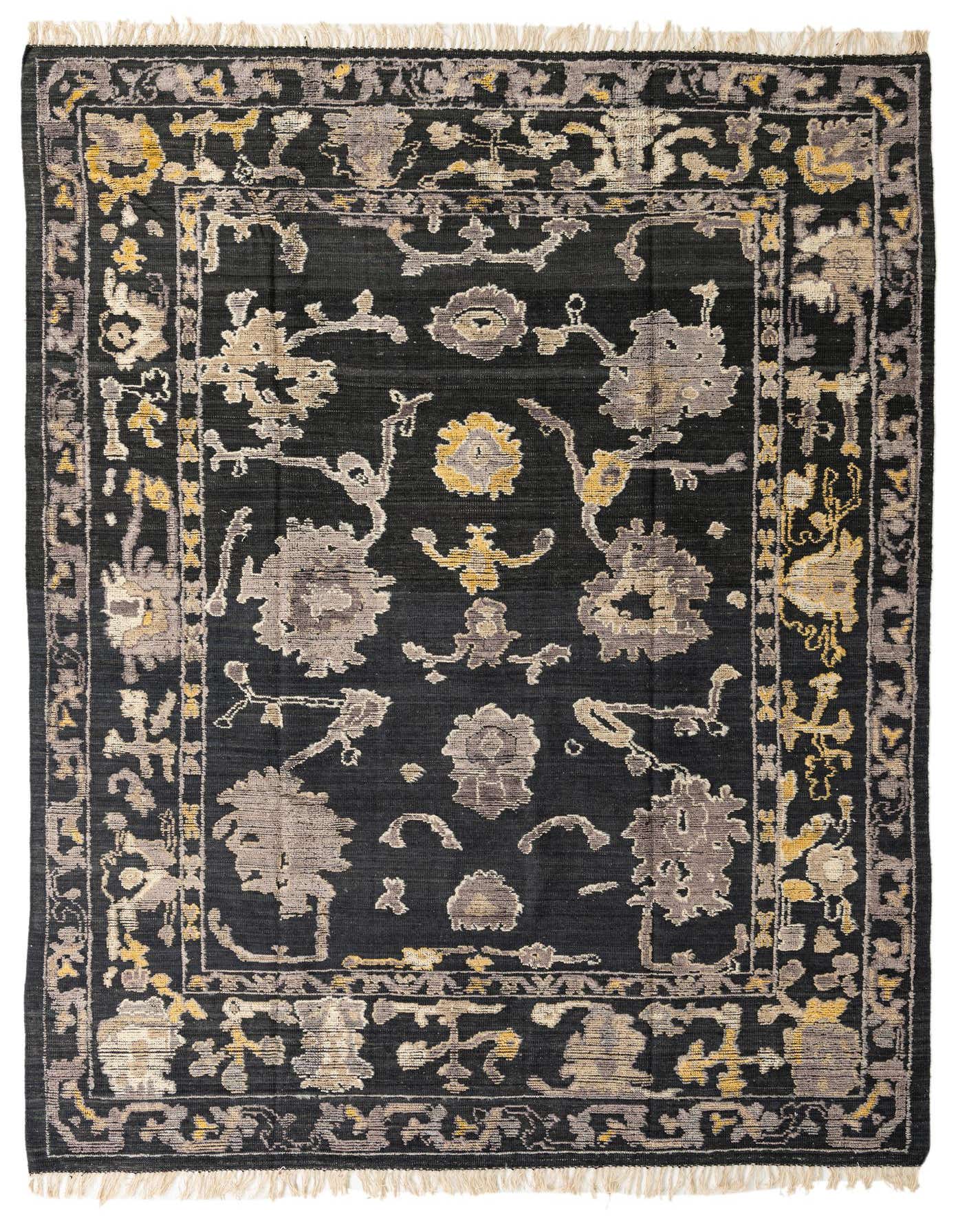 A 9x12 rectangular black wool area rug with a modern abstract pattern in grey and gold tones, featuring a subtle border.
