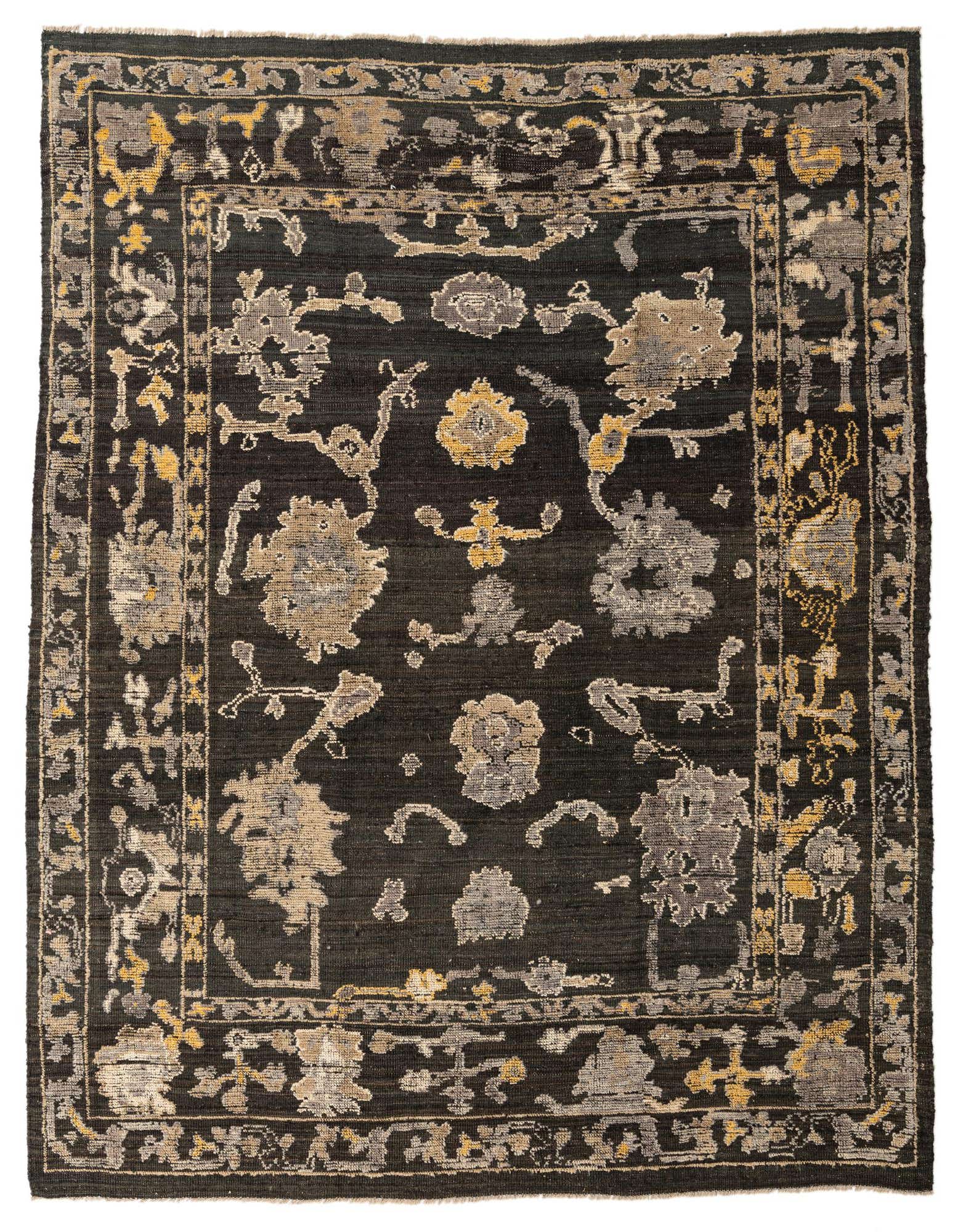 An 8x10 rectangular black Oushak rug with a modern abstract pattern in gray and gold tones.