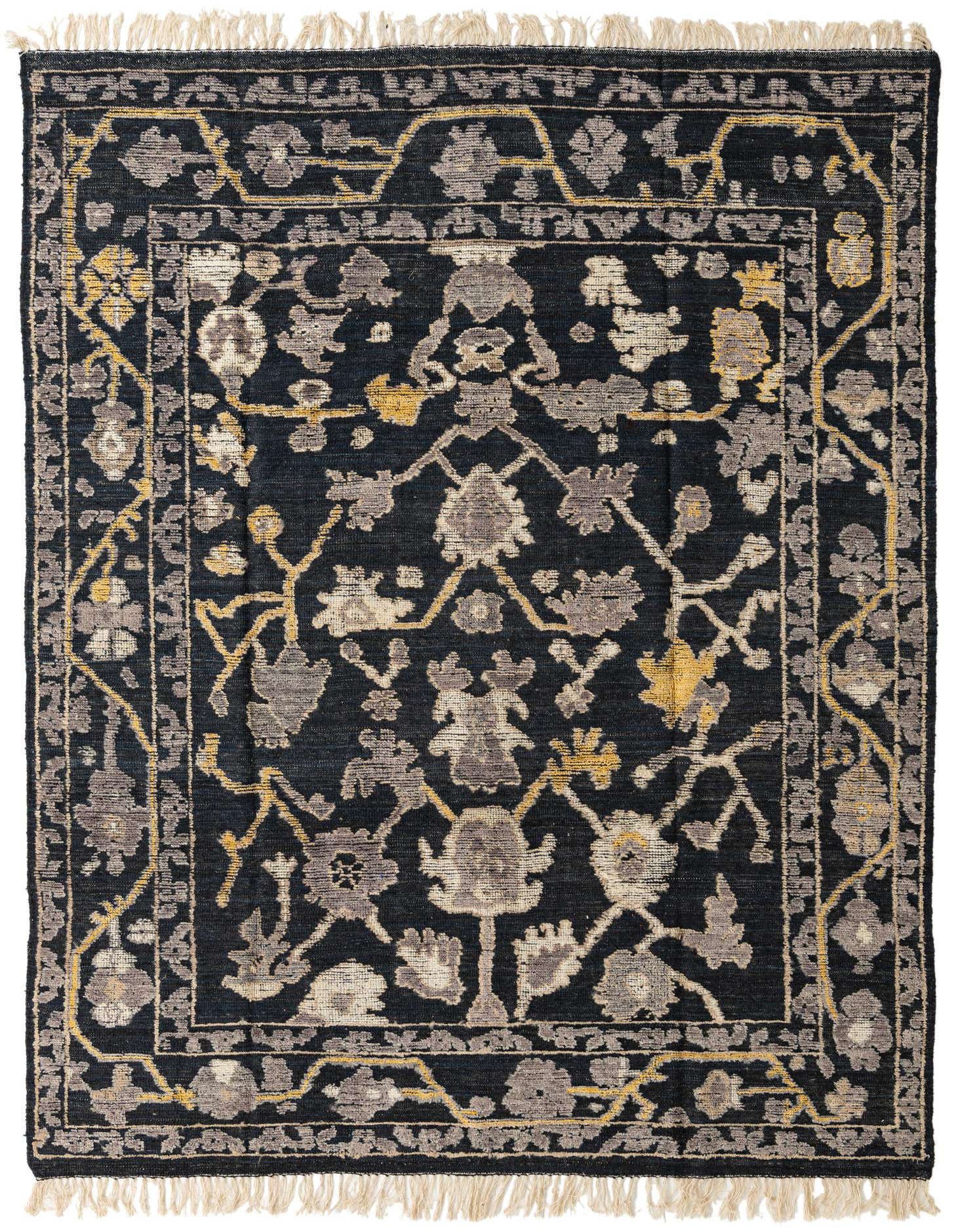 A rectangular 8x10 Oushak rug in black, gray, and gold with an abstract floral pattern and fringed edges.