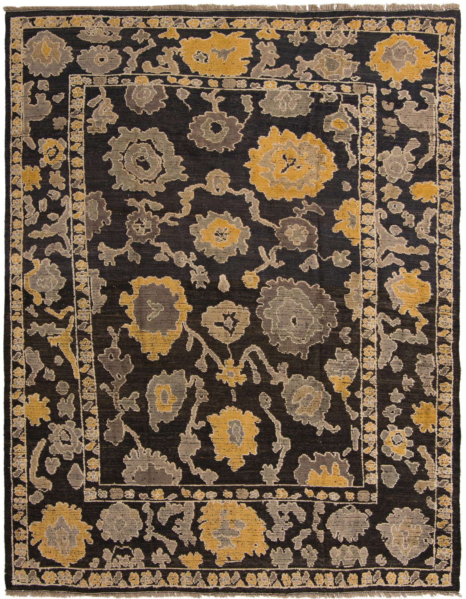 A 9x12 rectangular black wool rug with a modern abstract floral pattern in gold and gray, featuring a textured pile.