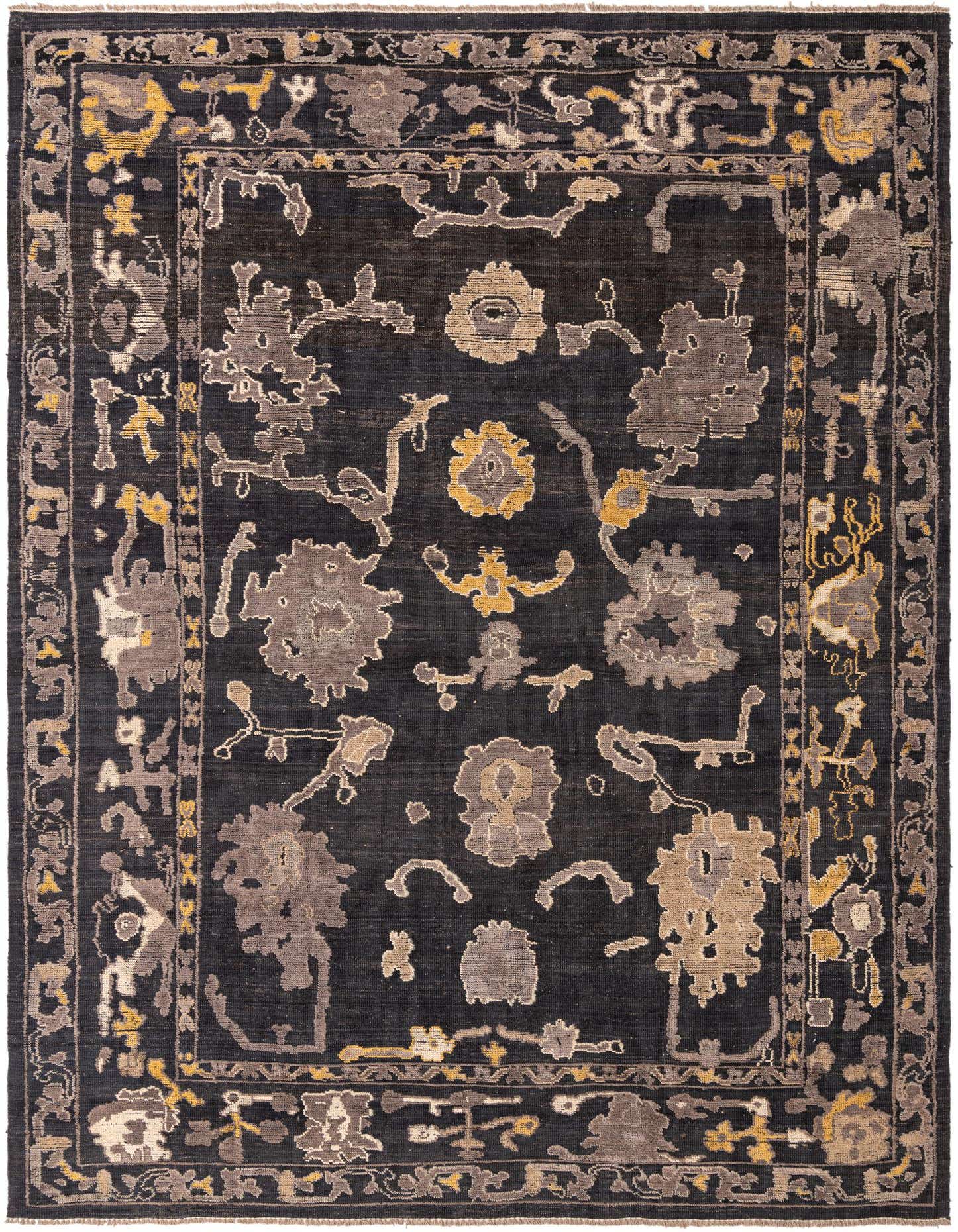 A 10x14 rectangular black modern Oushak rug with abstract floral patterns in grey, beige, and gold, suitable for an indoor living space.