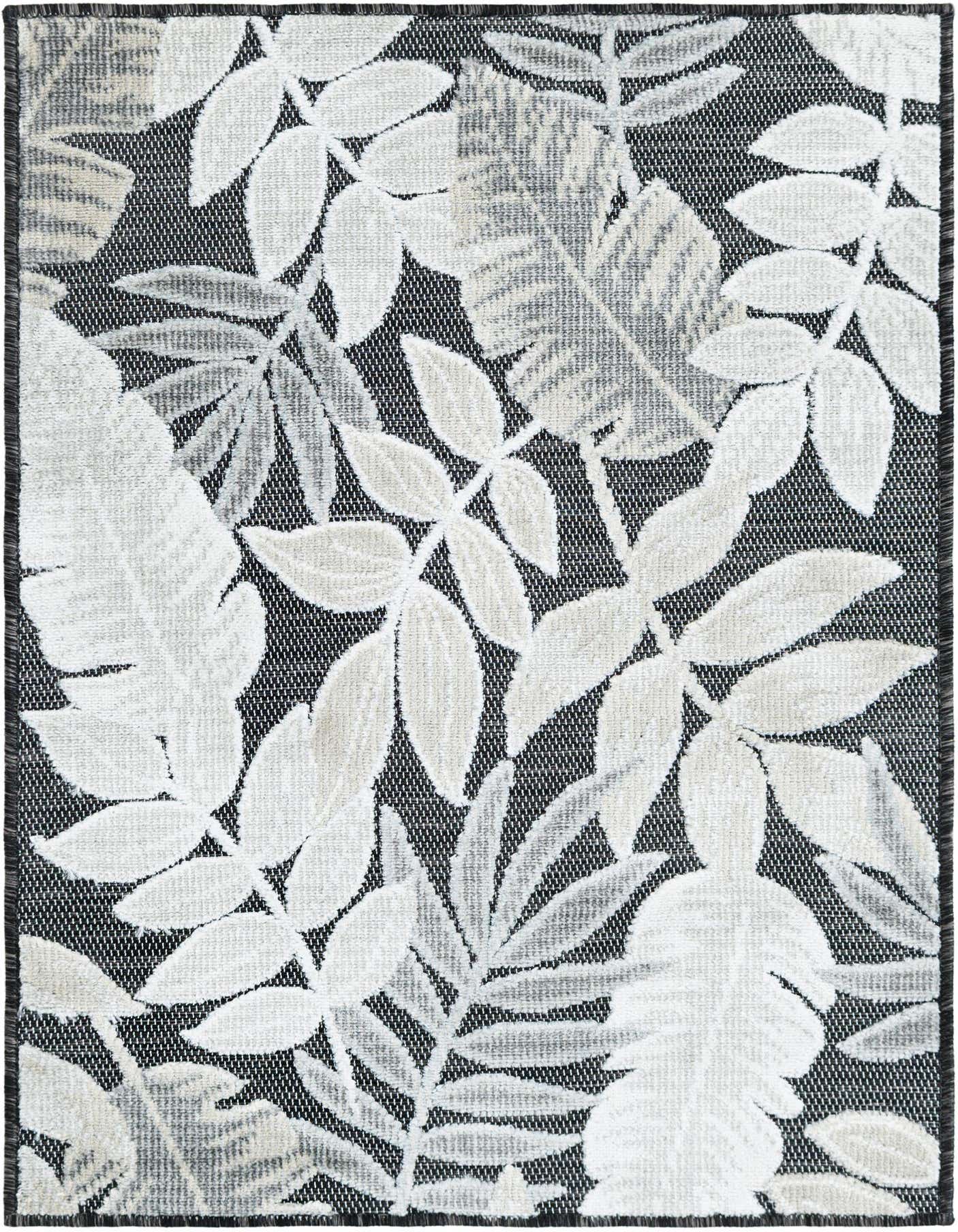 A 2x3 rectangular black indoor/outdoor rug with a modern tropical leaf pattern in white and light grey.
