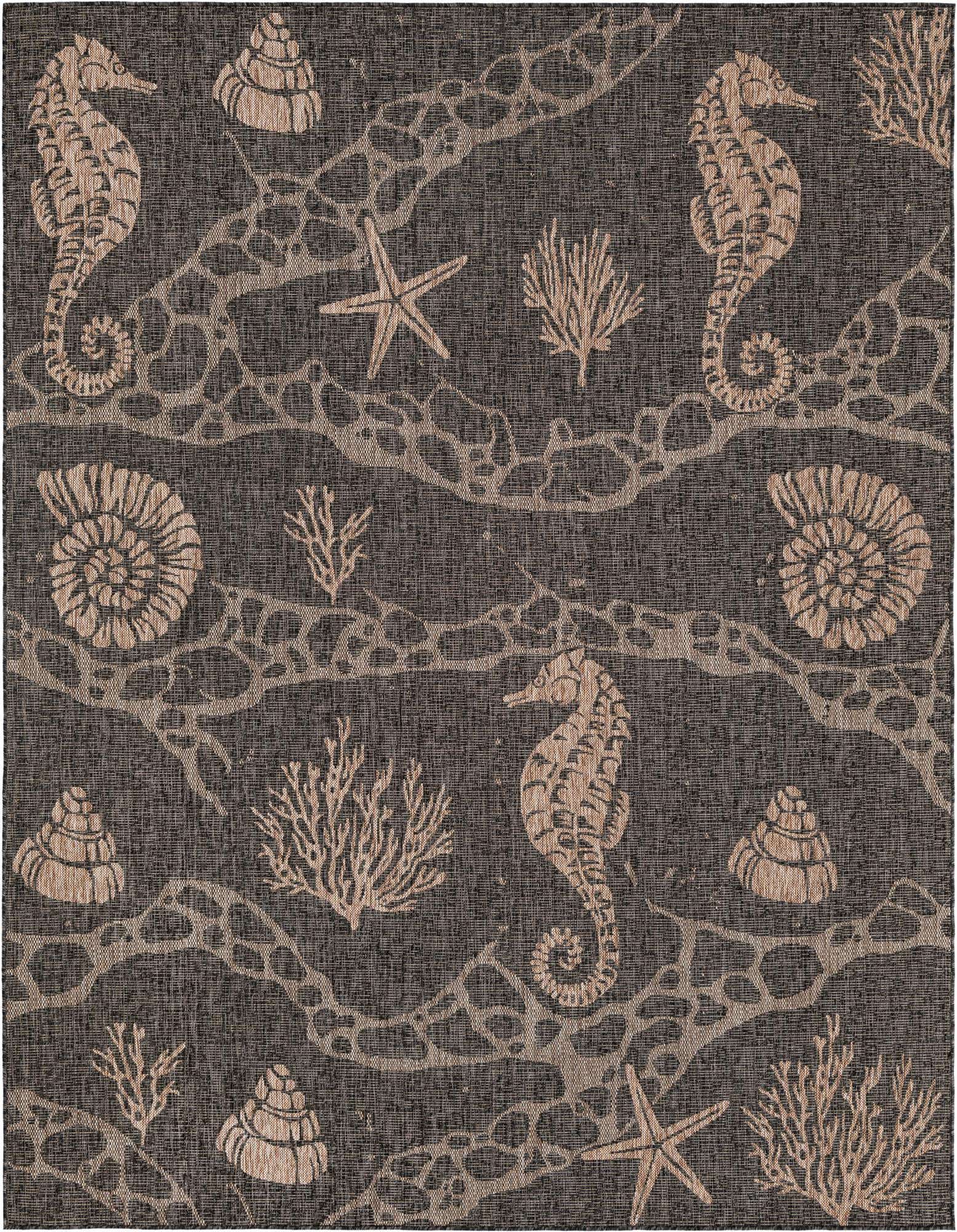 A rectangular 8x10 black and beige indoor/outdoor rug with a coastal pattern featuring seahorses, starfish, shells, and coral.
