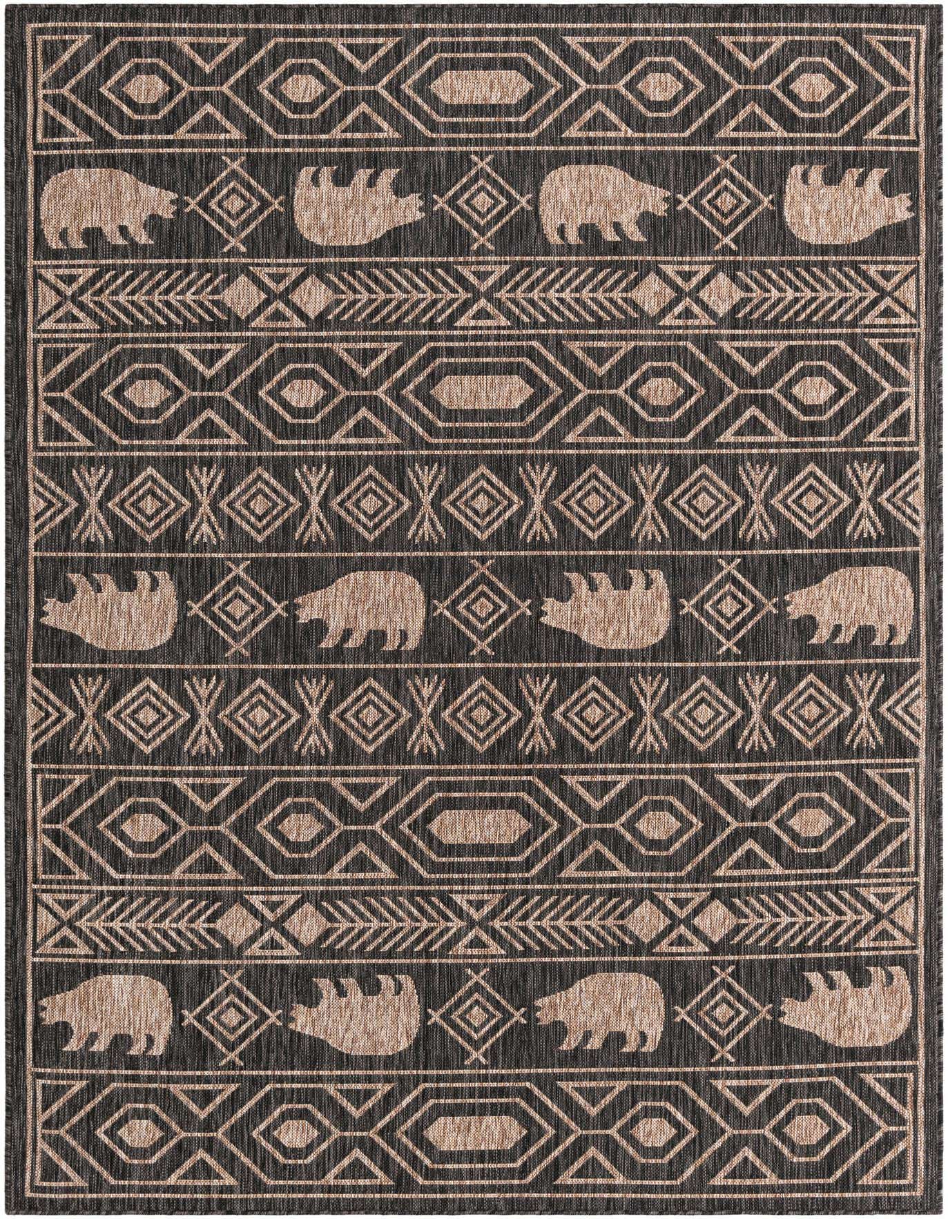A 6x9 rectangular black and beige tribal rug with bear motifs and geometric patterns, suitable for indoor or outdoor use.