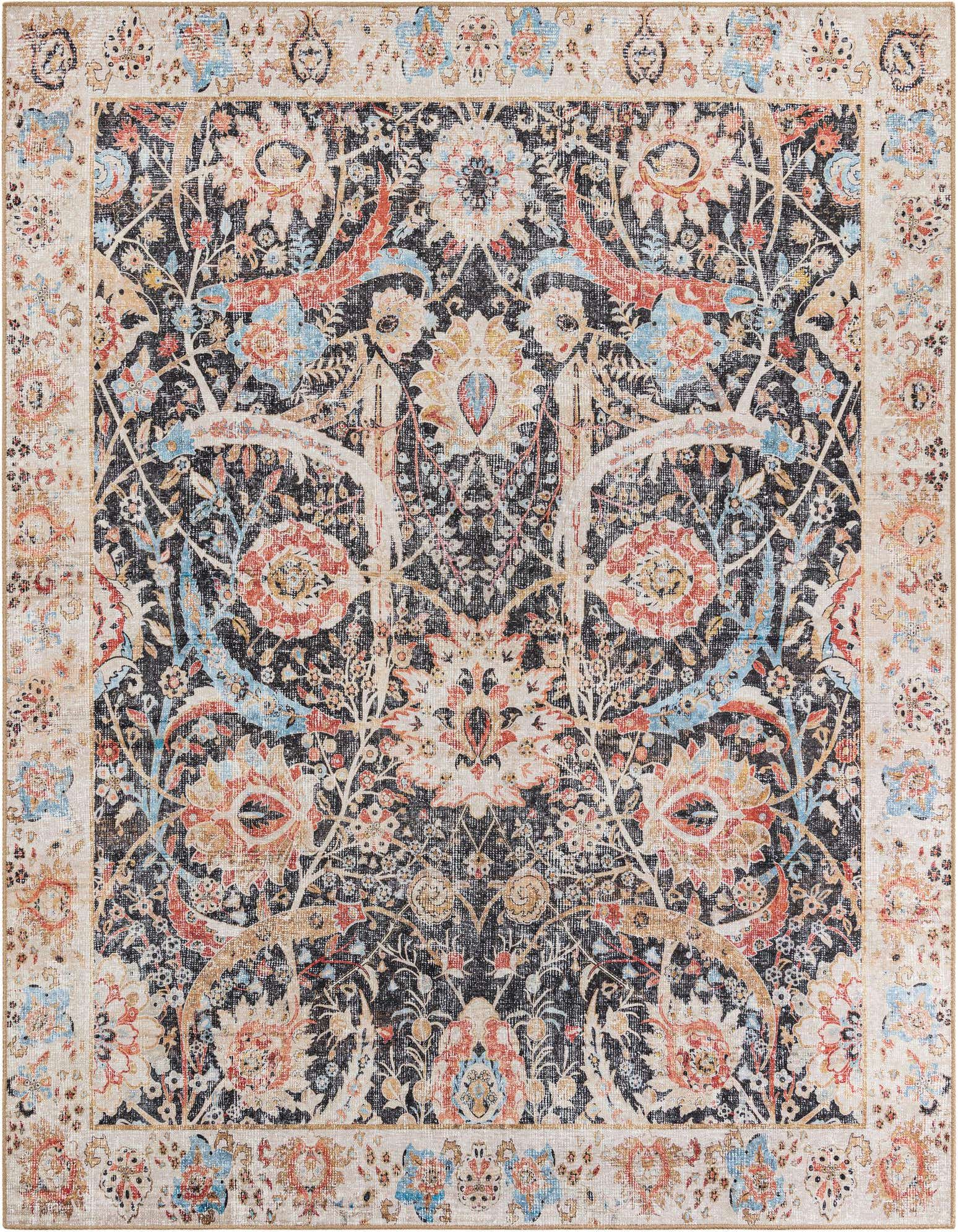 An 8x10 rectangular indoor rug with a distressed black center and a detailed floral and botanical pattern in muted orange, blue, and cream, framed by a light border.