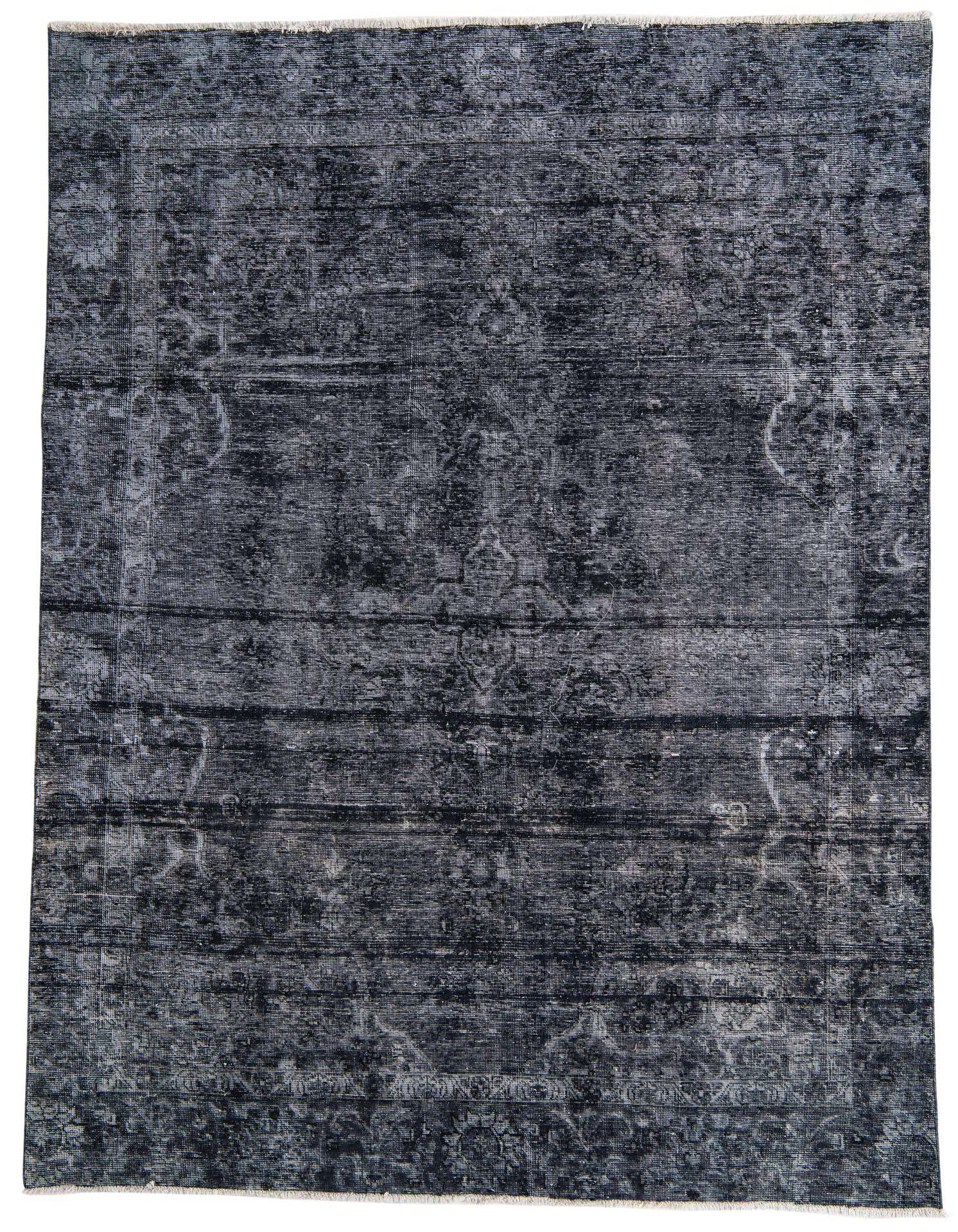 A 7x10 rectangular black wool rug with a distressed Persian-inspired pattern, ideal for a living room.