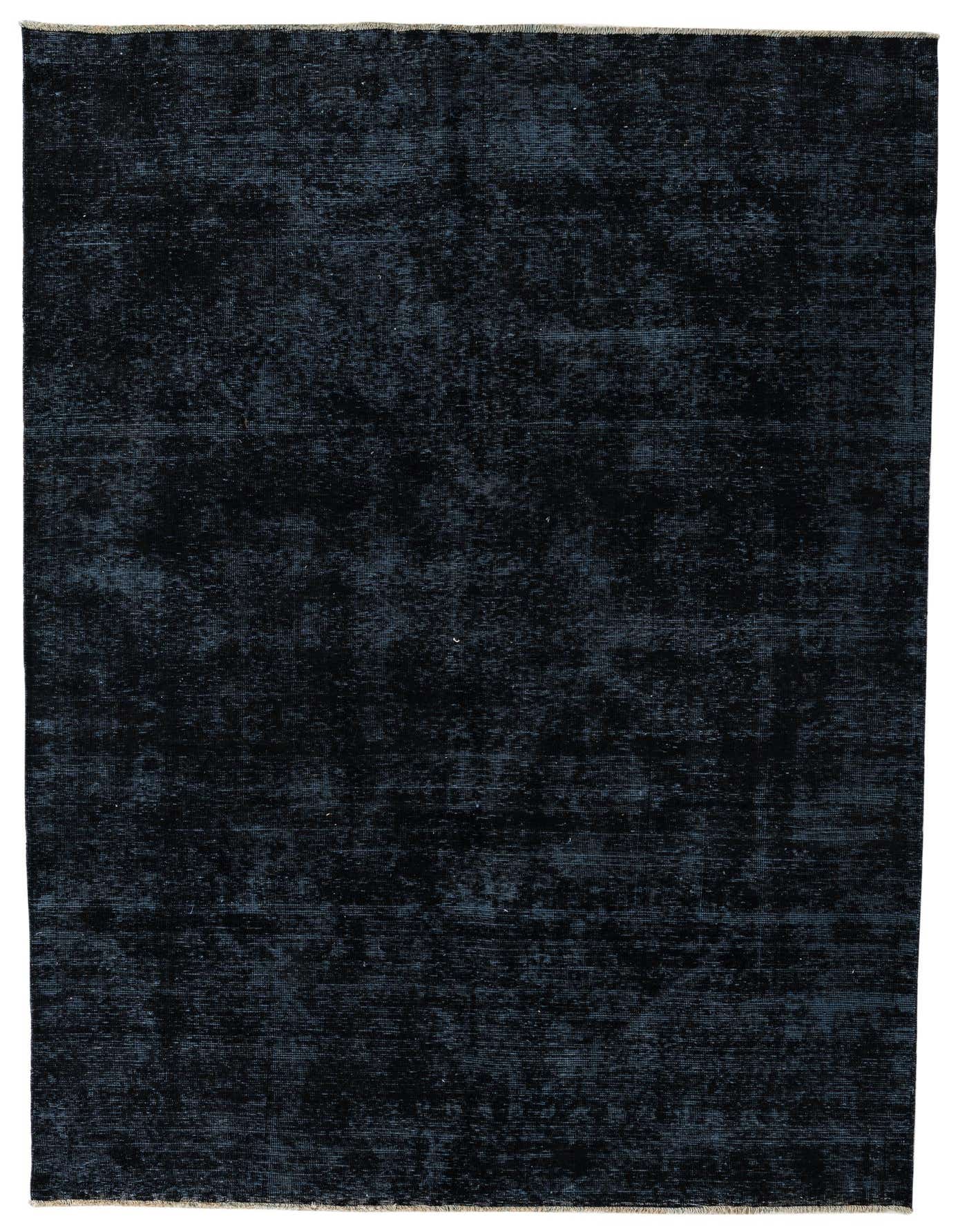 A 6x9 rectangular Rugs.com Ultra Vintage rug in deep black with subtle distressed Persian and Oriental patterns, suitable for a living room.