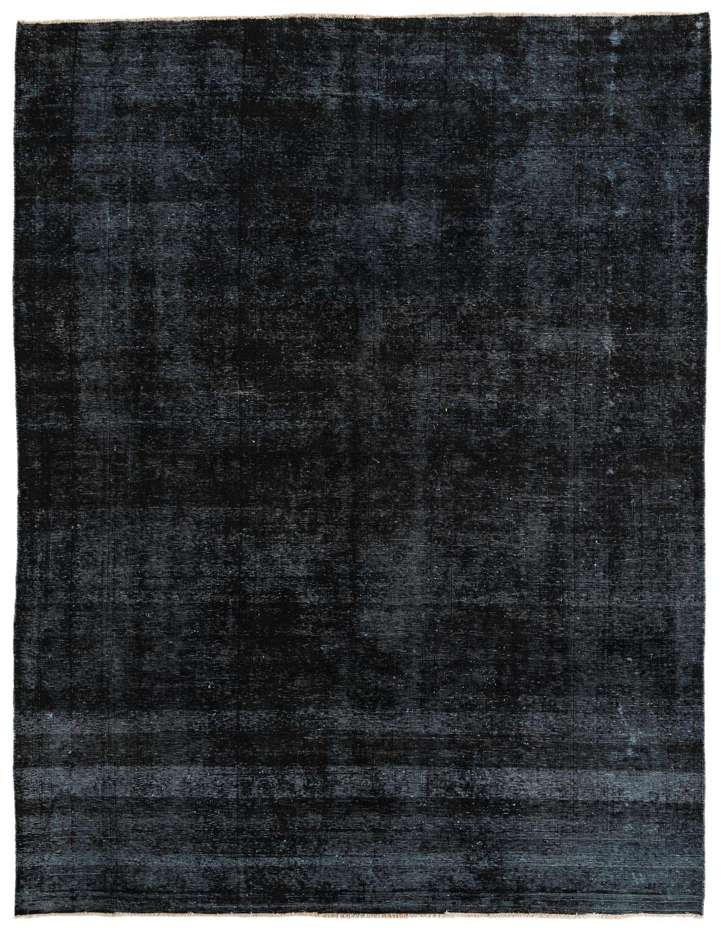 A rectangular 8x11 Ultra Vintage rug in deep black, featuring a subtle distressed Persian-inspired pattern, perfect for a modern living room.