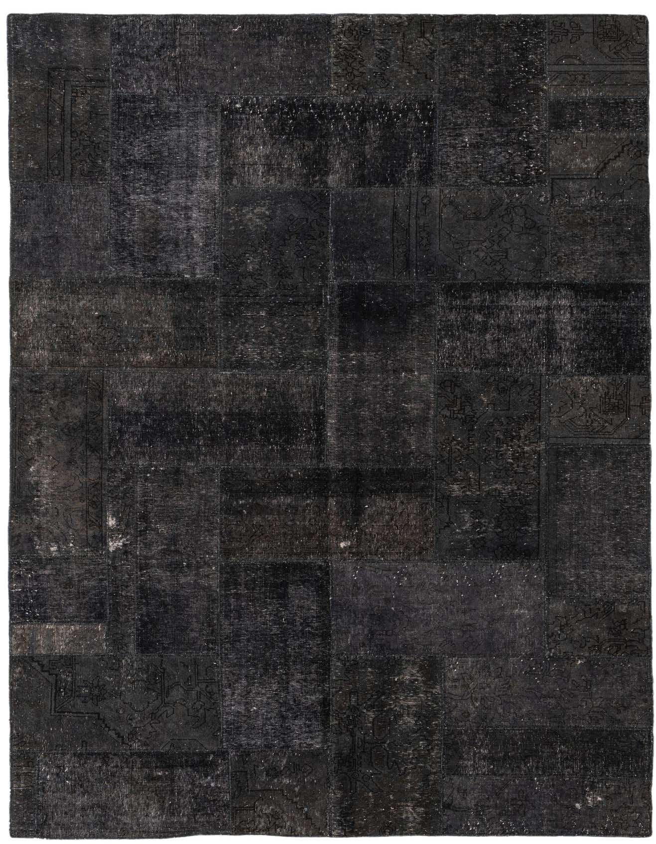 A 7x10 rectangular Ultra Vintage black wool rug featuring a distressed patchwork design with subtle Persian and abstract patterns, ideal for a modern living room.
