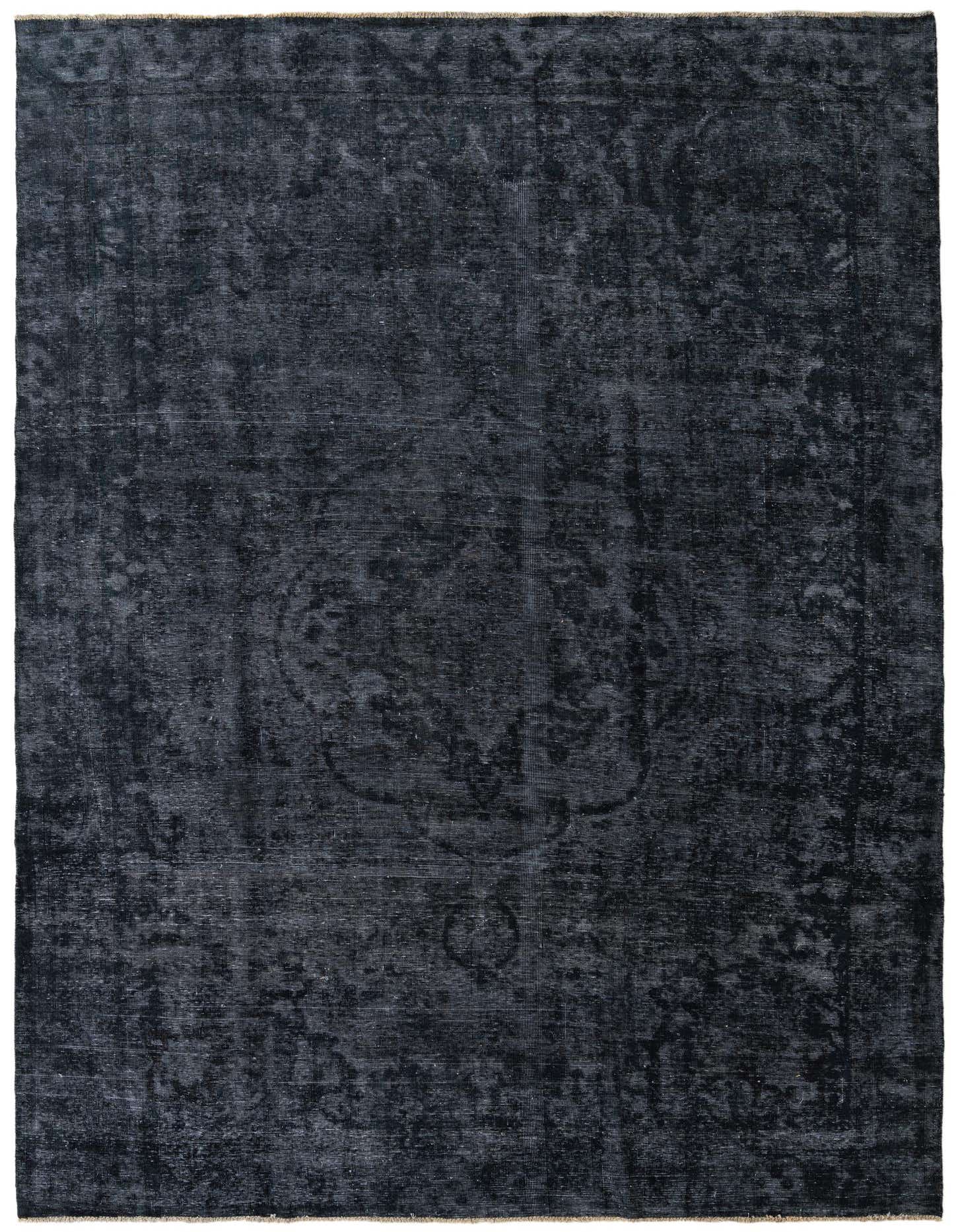 A 9x11 rectangular black wool area rug featuring a subtle, distressed Persian medallion pattern, perfect for an indoor living space.