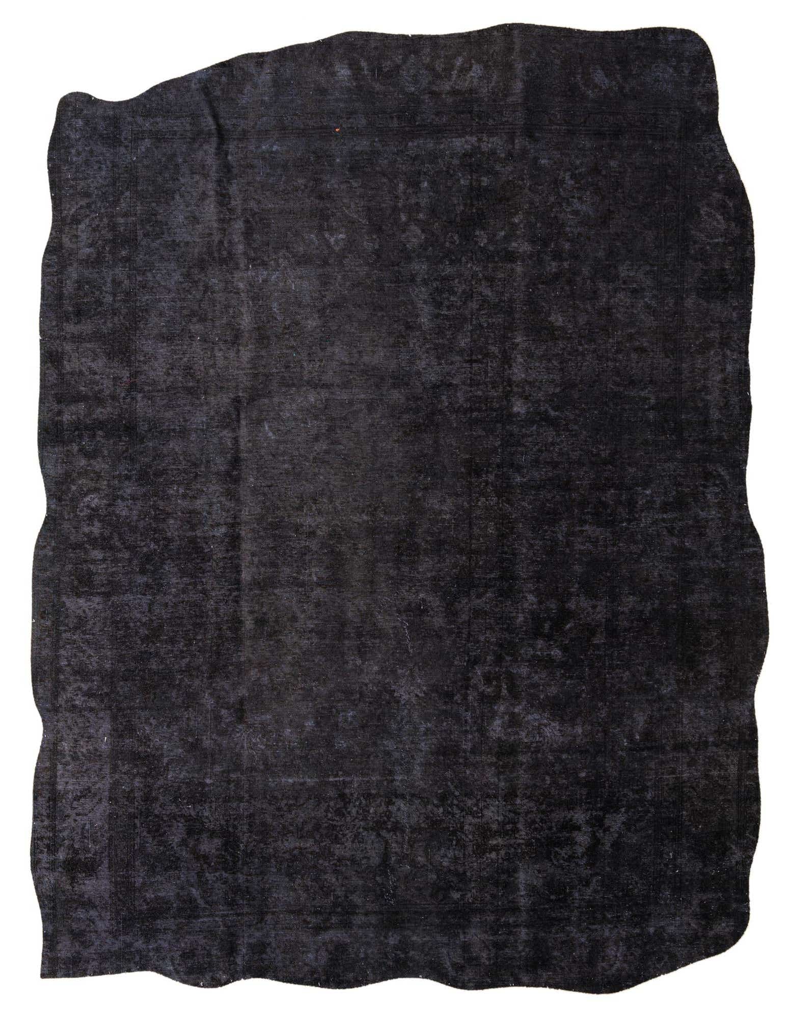 A 10x13 rectangular black area rug with a subtle, distressed Persian pattern, perfect for a living room.