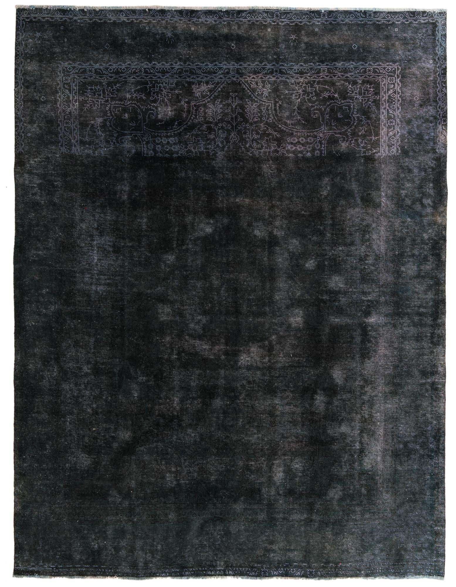 A 9x12 rectangular black wool rug with a subtle, faded Persian-style border pattern at the top, suitable for a living room.