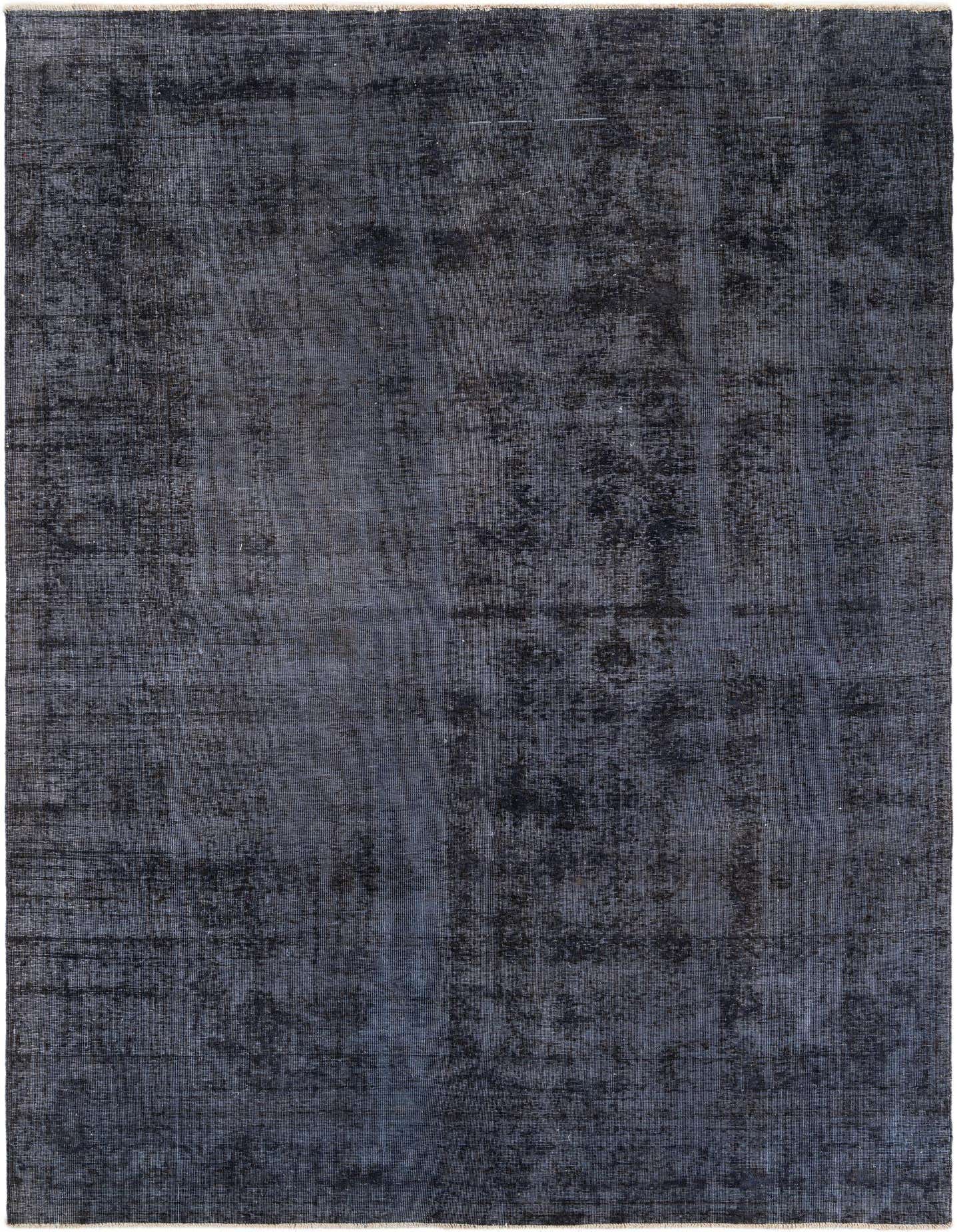 A 7x10 rectangular black wool rug featuring a subtle, distressed Persian medallion pattern, ideal for a living room.