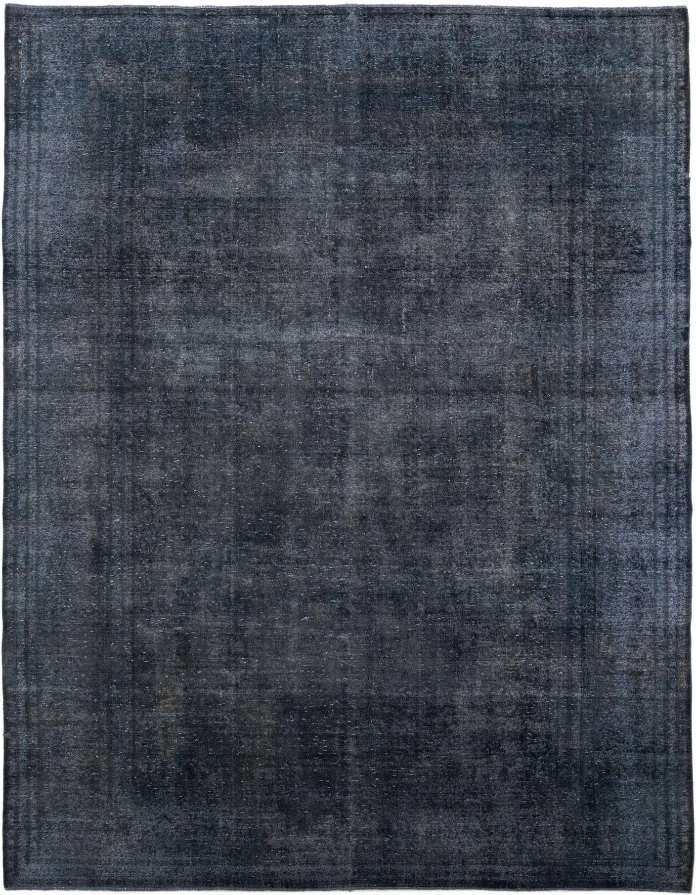 A large 9x12 rectangular black area rug with a subtle distressed Persian medallion pattern, perfect for a living room.