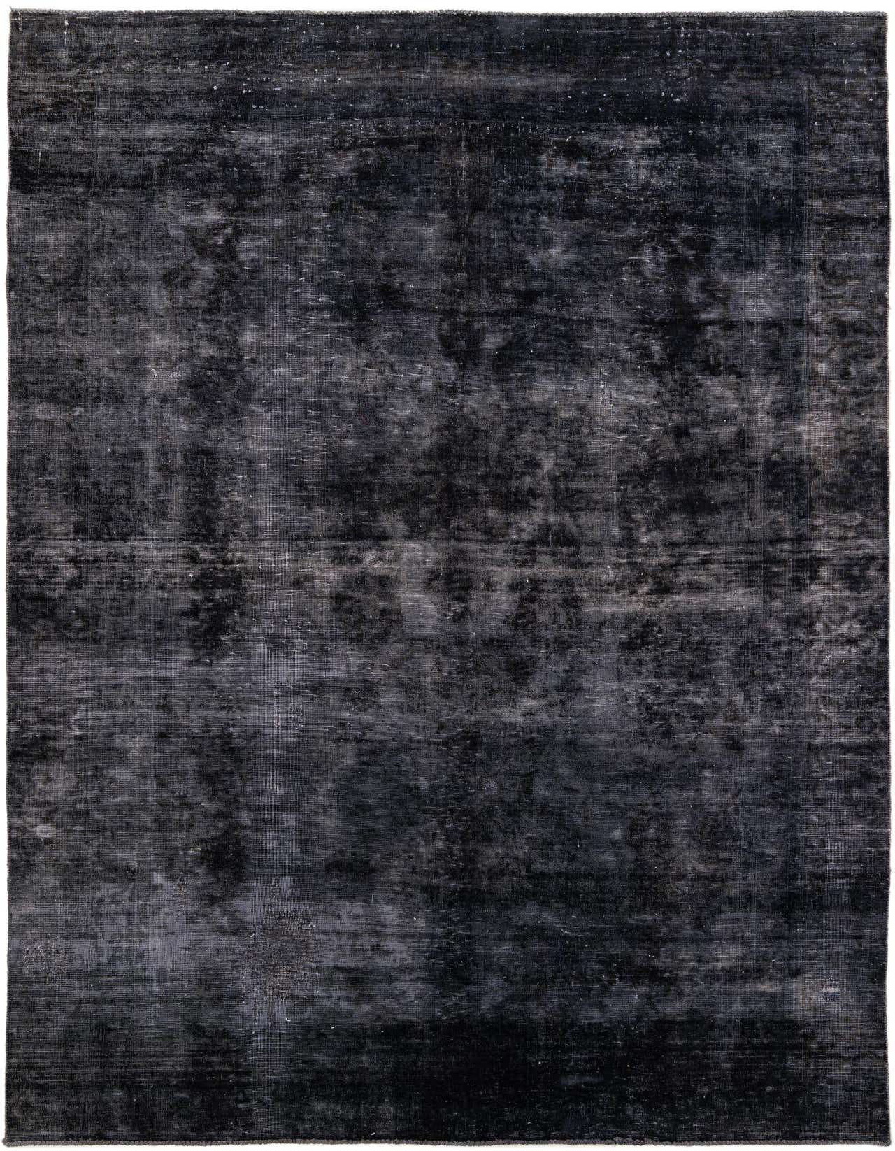 A 7x10 rectangular black wool rug with a distressed vintage Persian pattern, suitable for a living room.